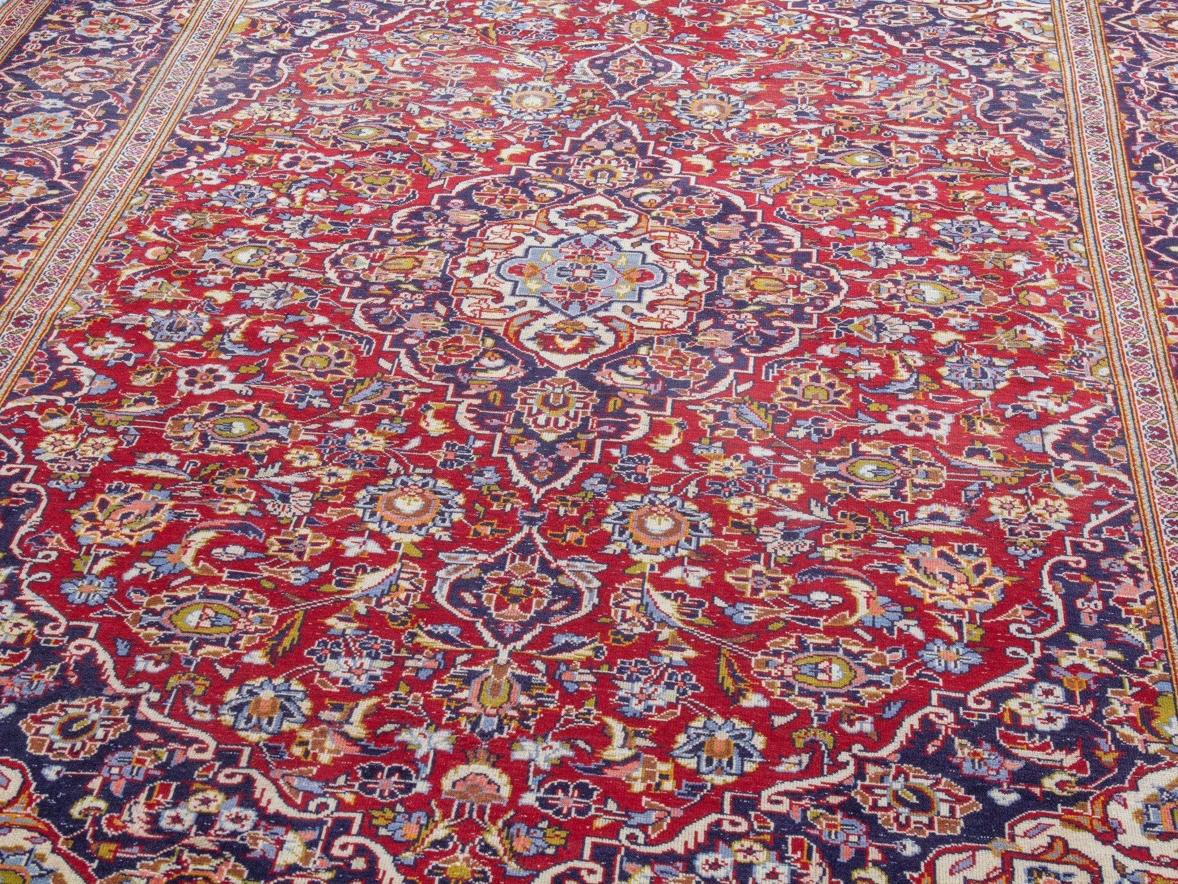 Persian Kashan area rug in deep red and dark blue, view 7 of 22