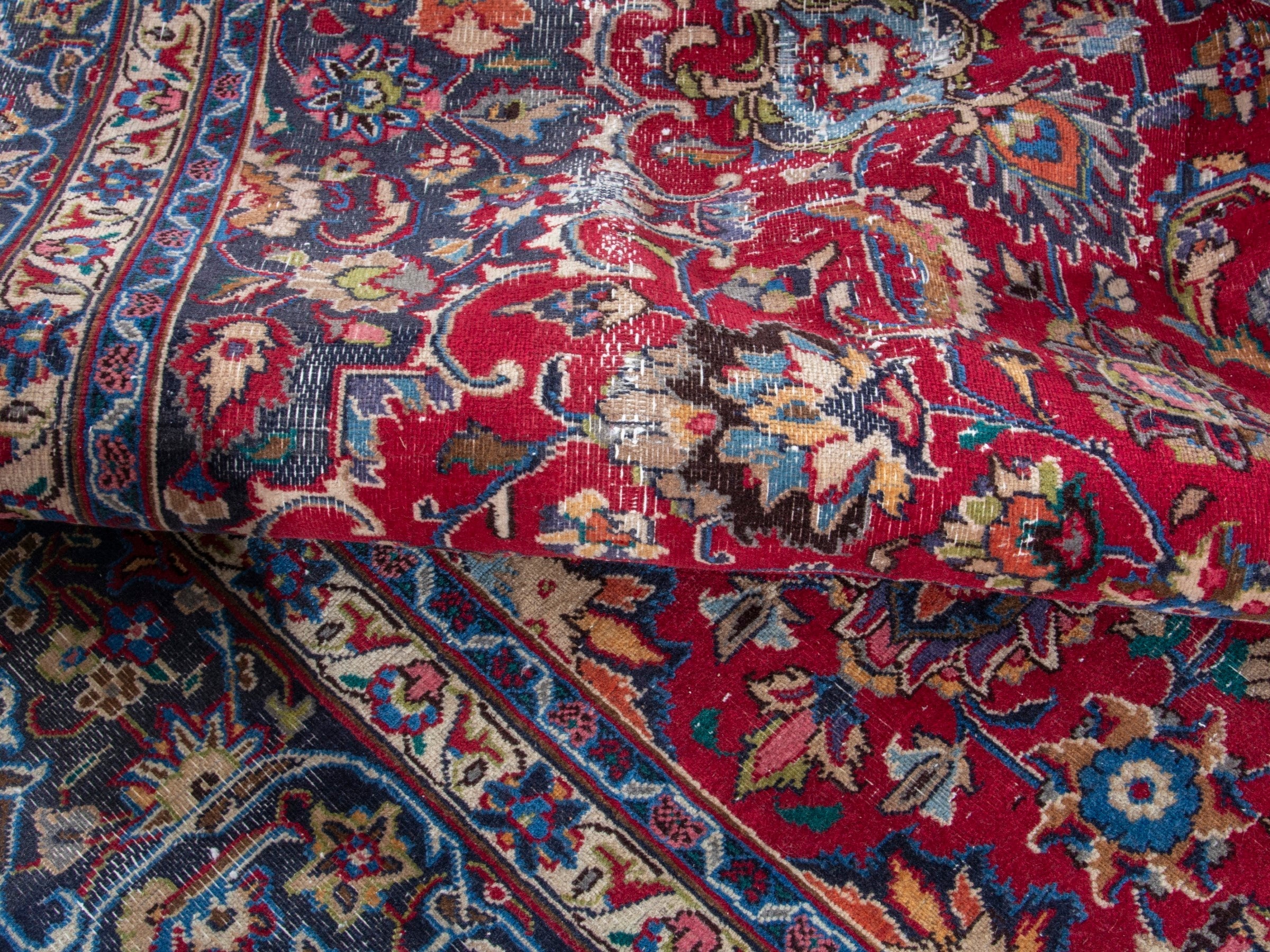 Persian Mashhad oversized rug in deep red and navy, view 15 of 19