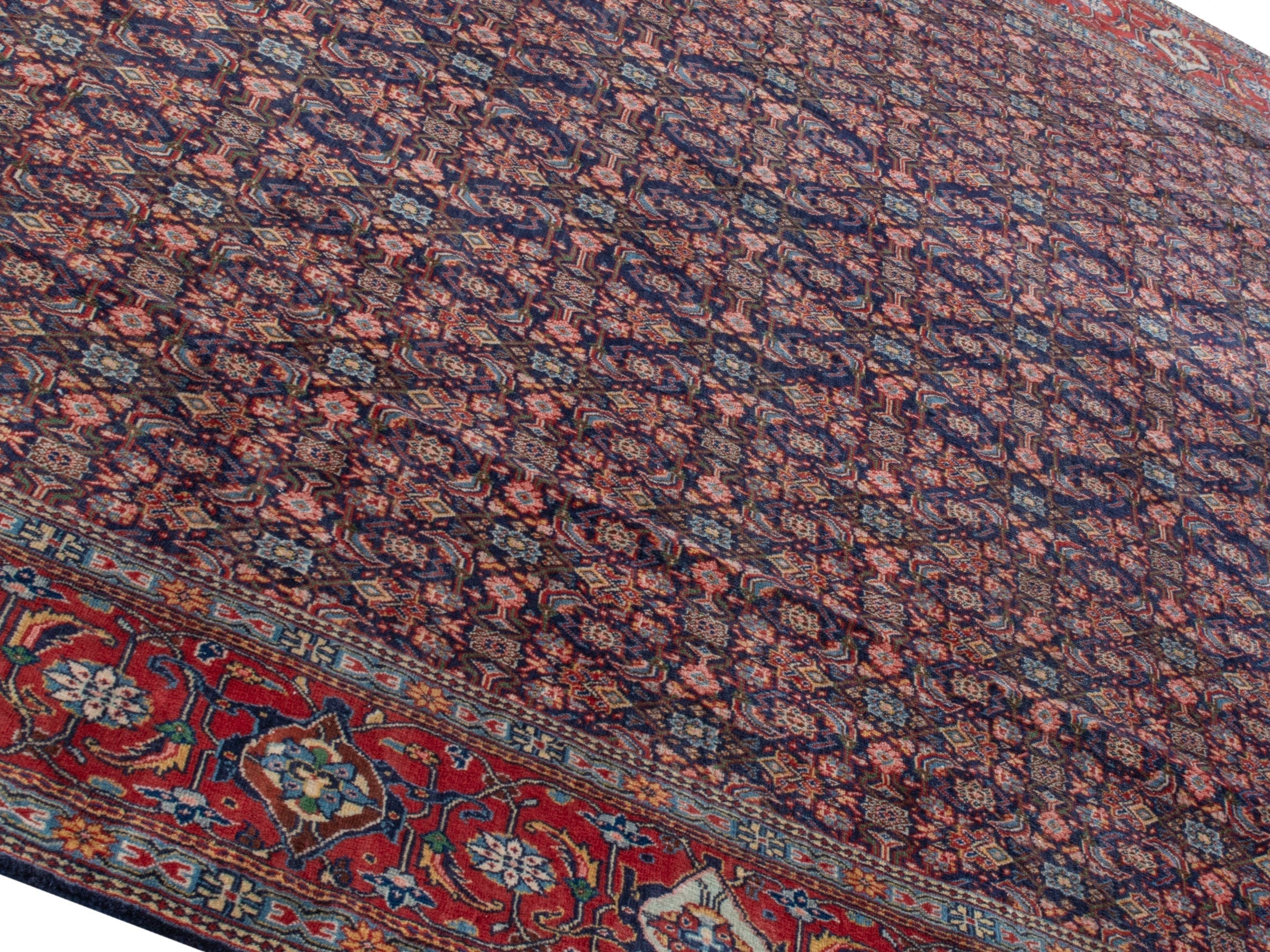 Persian Mahal oversized rug in navy and deep red, view 4 of 28