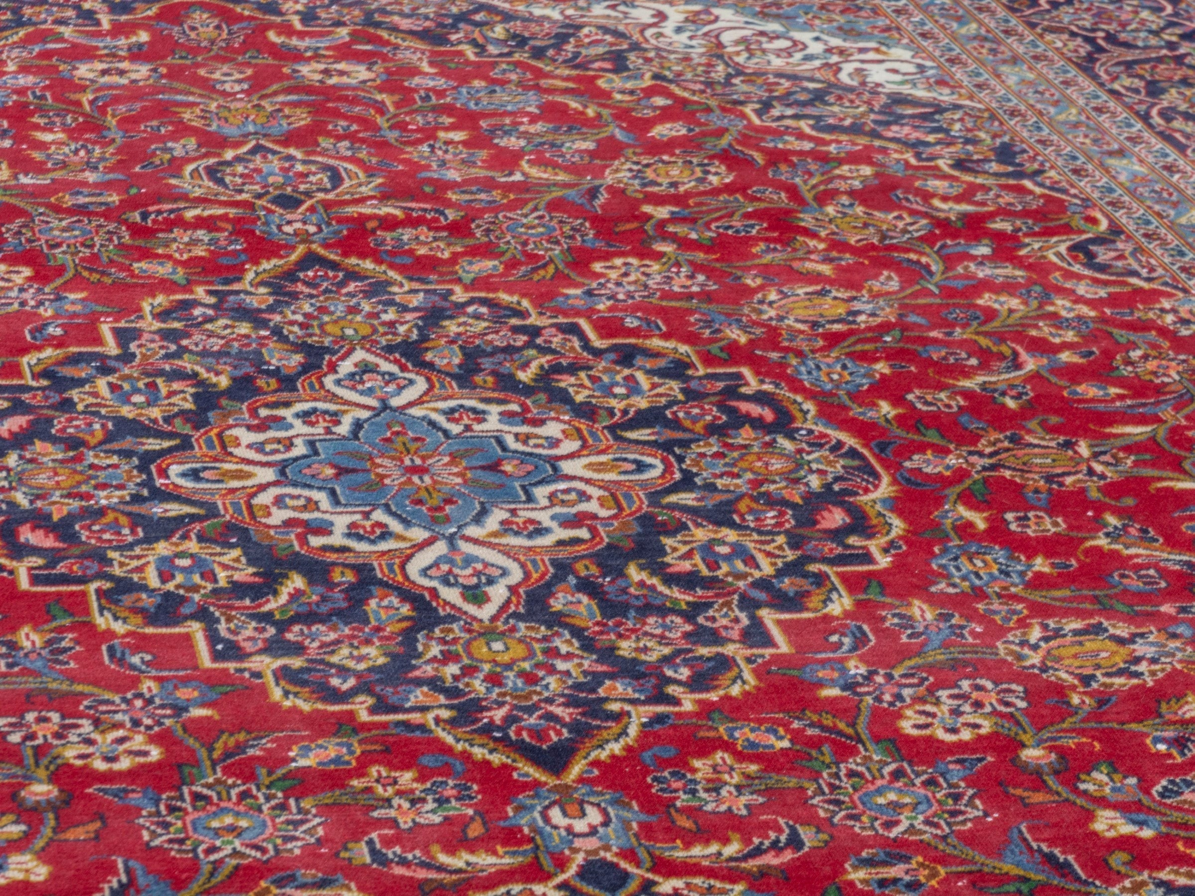 Persian Kashan oversized rug in deep red and navy, view 8 of 23