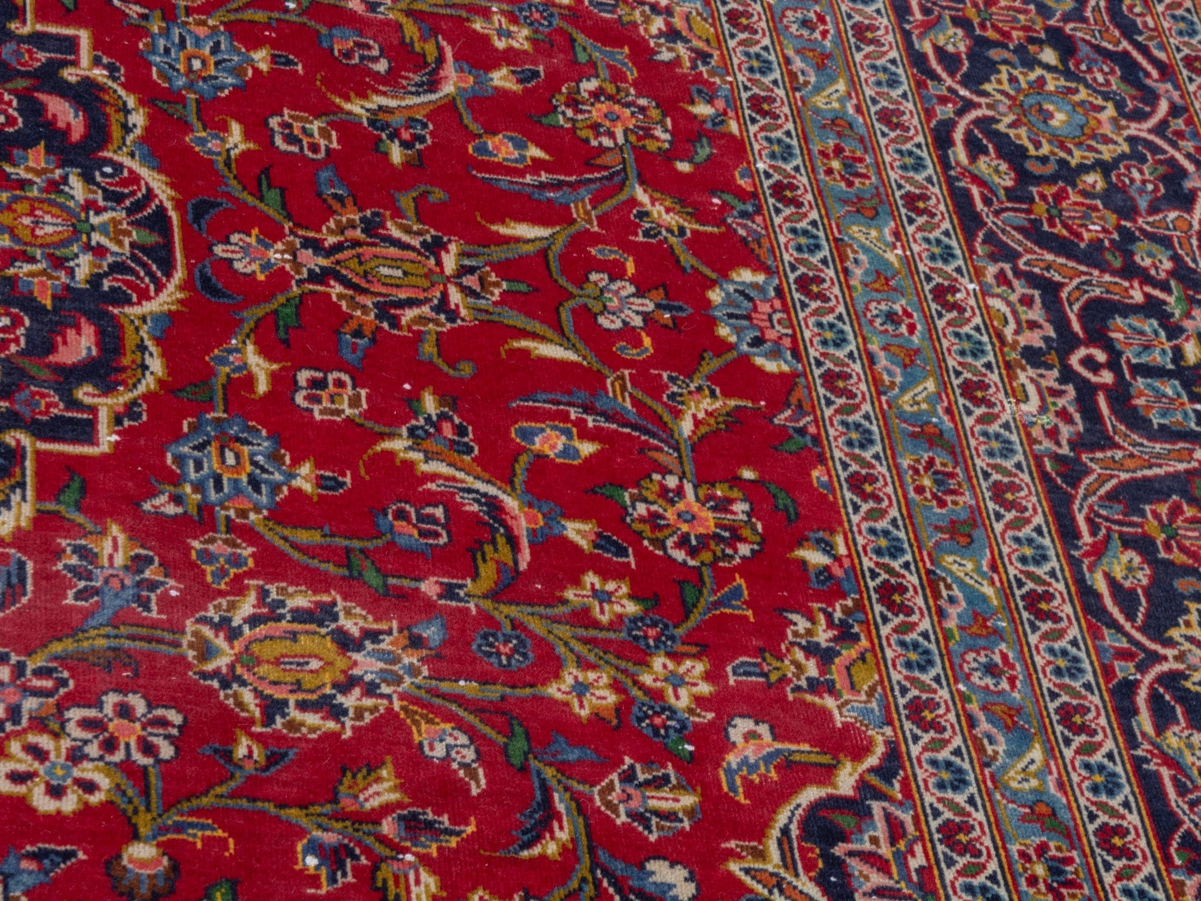 Persian Kashan oversized rug in deep red and navy, view 9 of 23