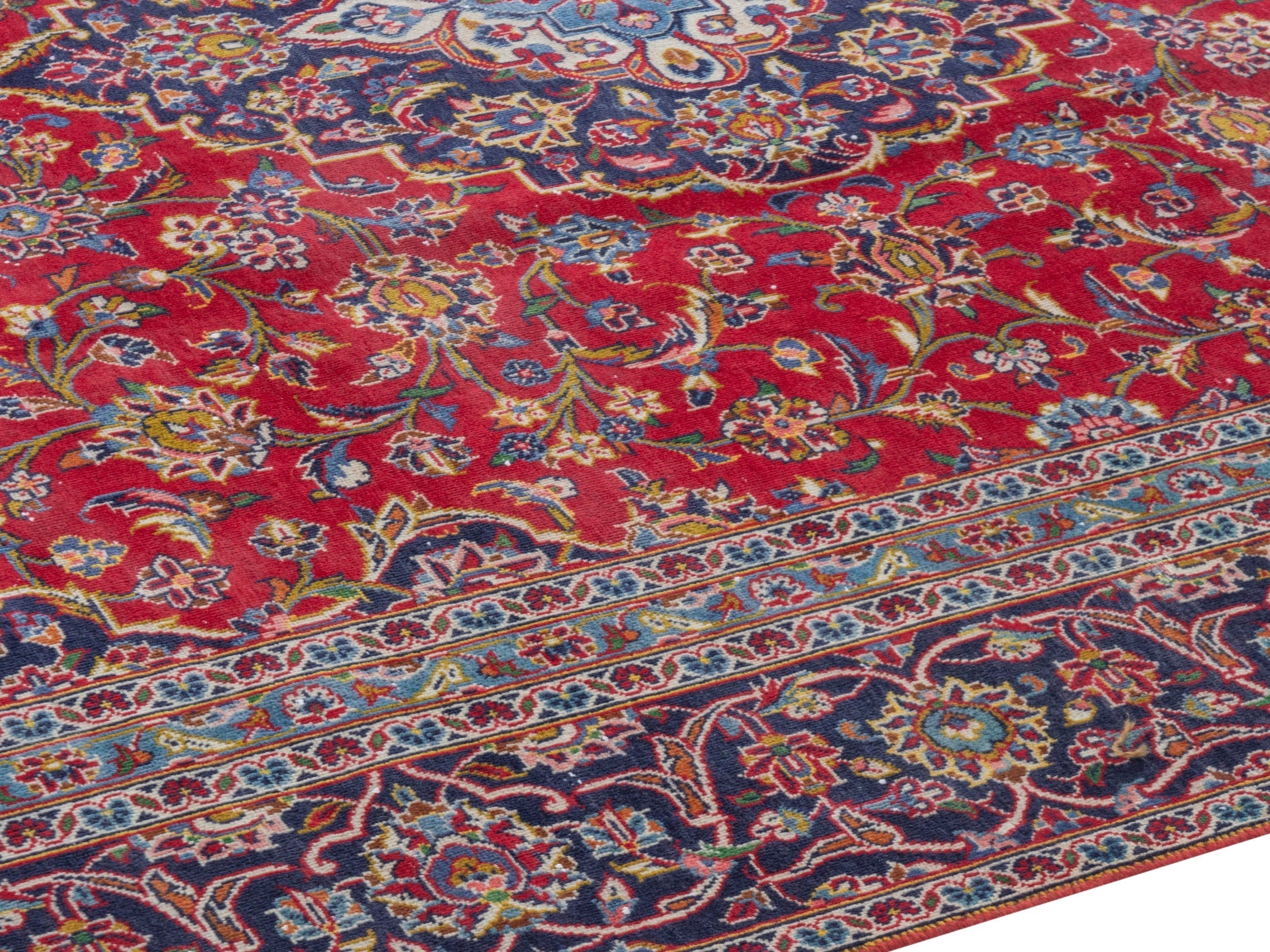 Persian Kashan oversized rug in deep red and navy, view 6 of 23