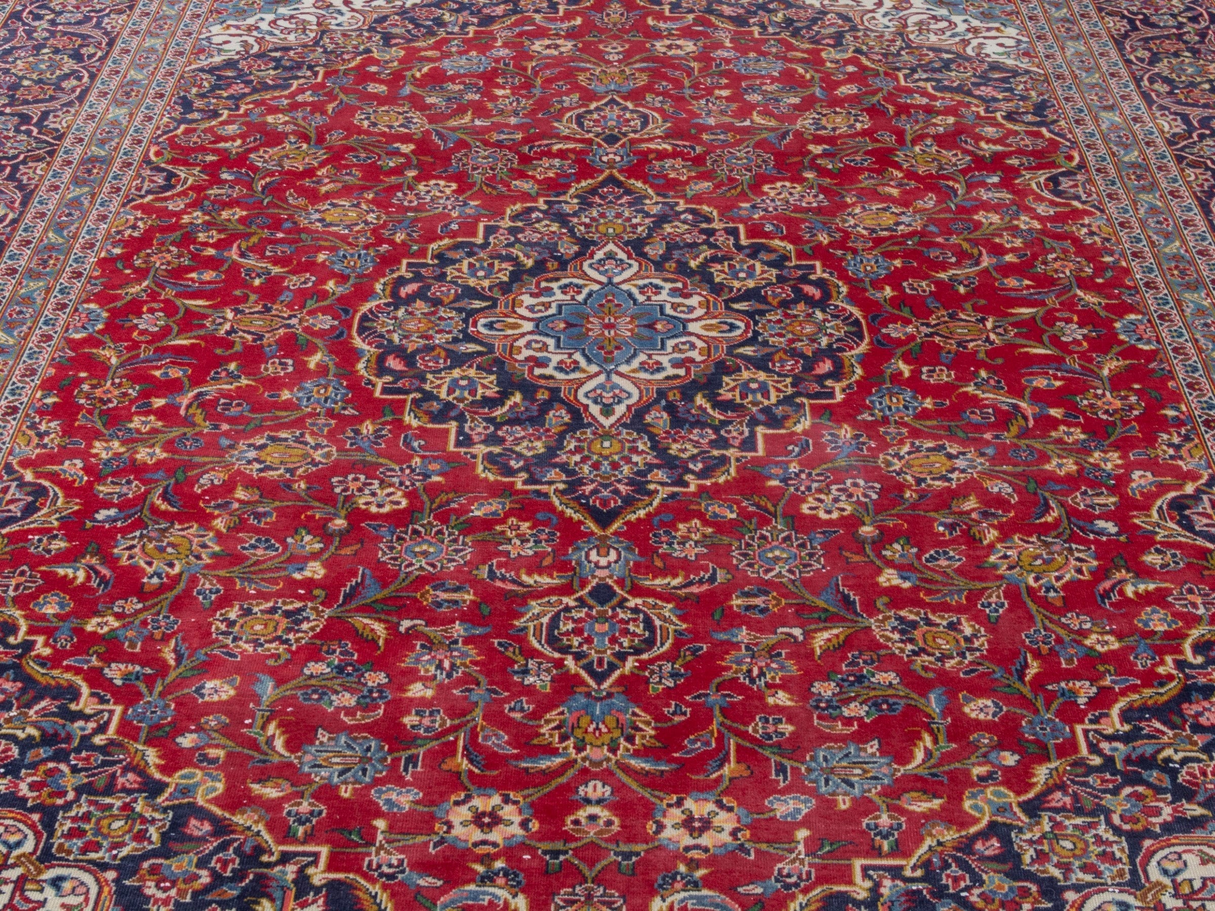 Persian Kashan oversized rug in deep red and navy, view 7 of 23