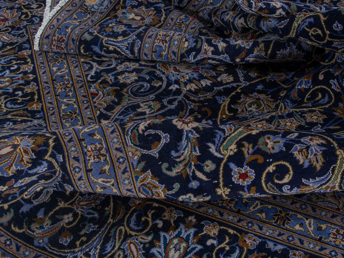 Persian Kashan oversized rug in navy and cream, view 18 of 22