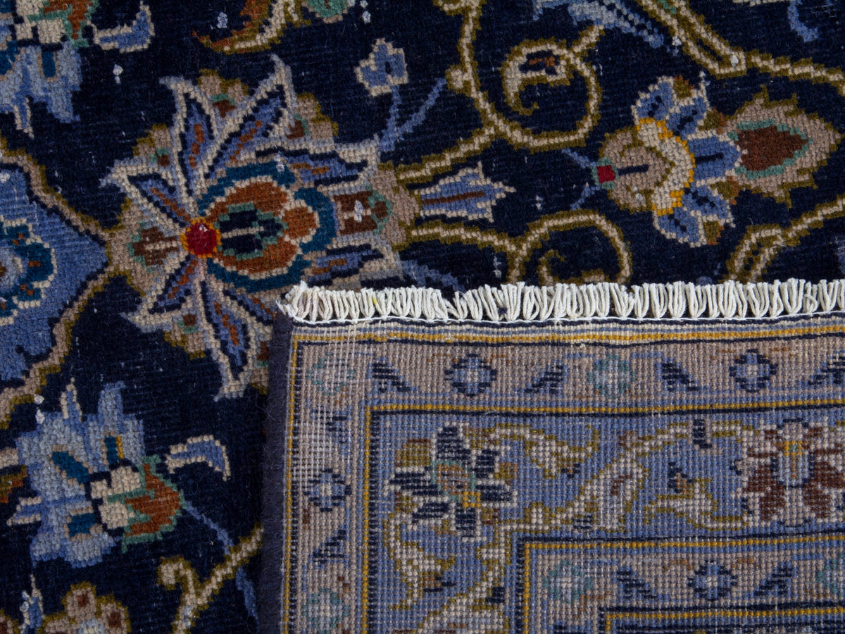 Persian Kashan oversized rug in navy and cream, view 22 of 22