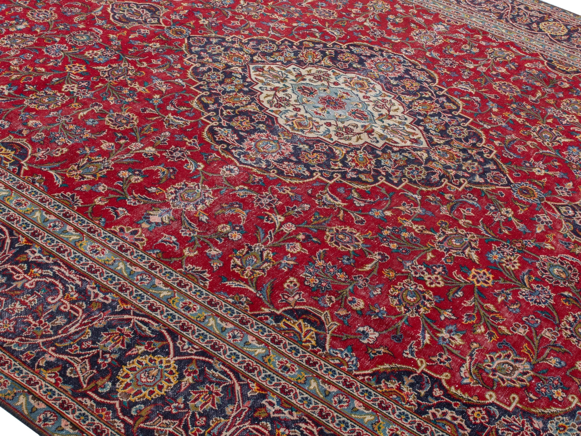 Persian Kashan oversized rug in deep red and aubergine, view 4 of 21
