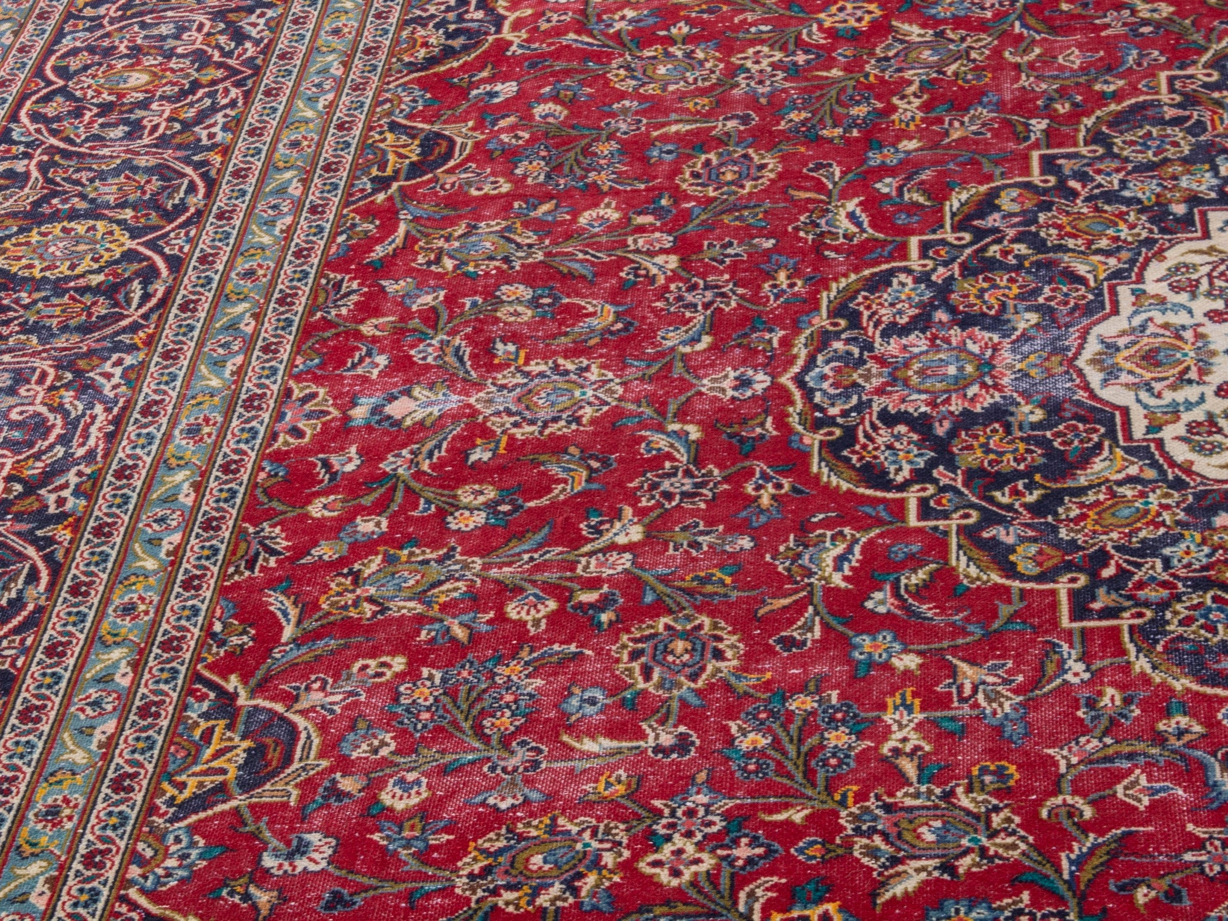 Persian Kashan oversized rug in deep red and aubergine, view 9 of 21