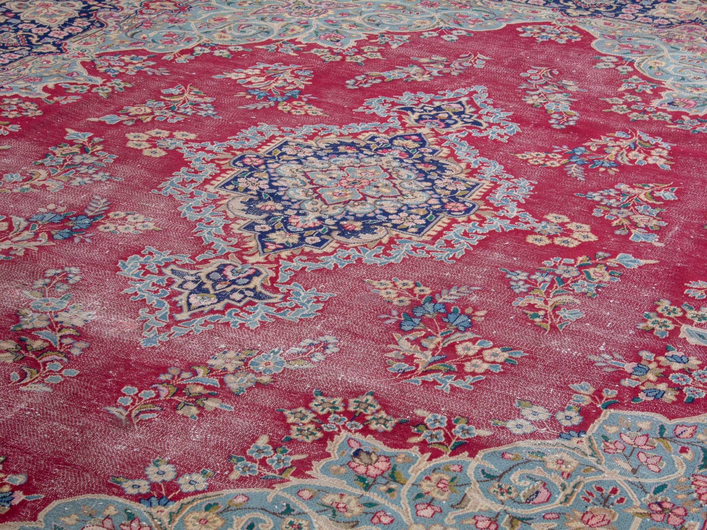Persian Kerman oversized rug in rose and navy, view 7 of 19