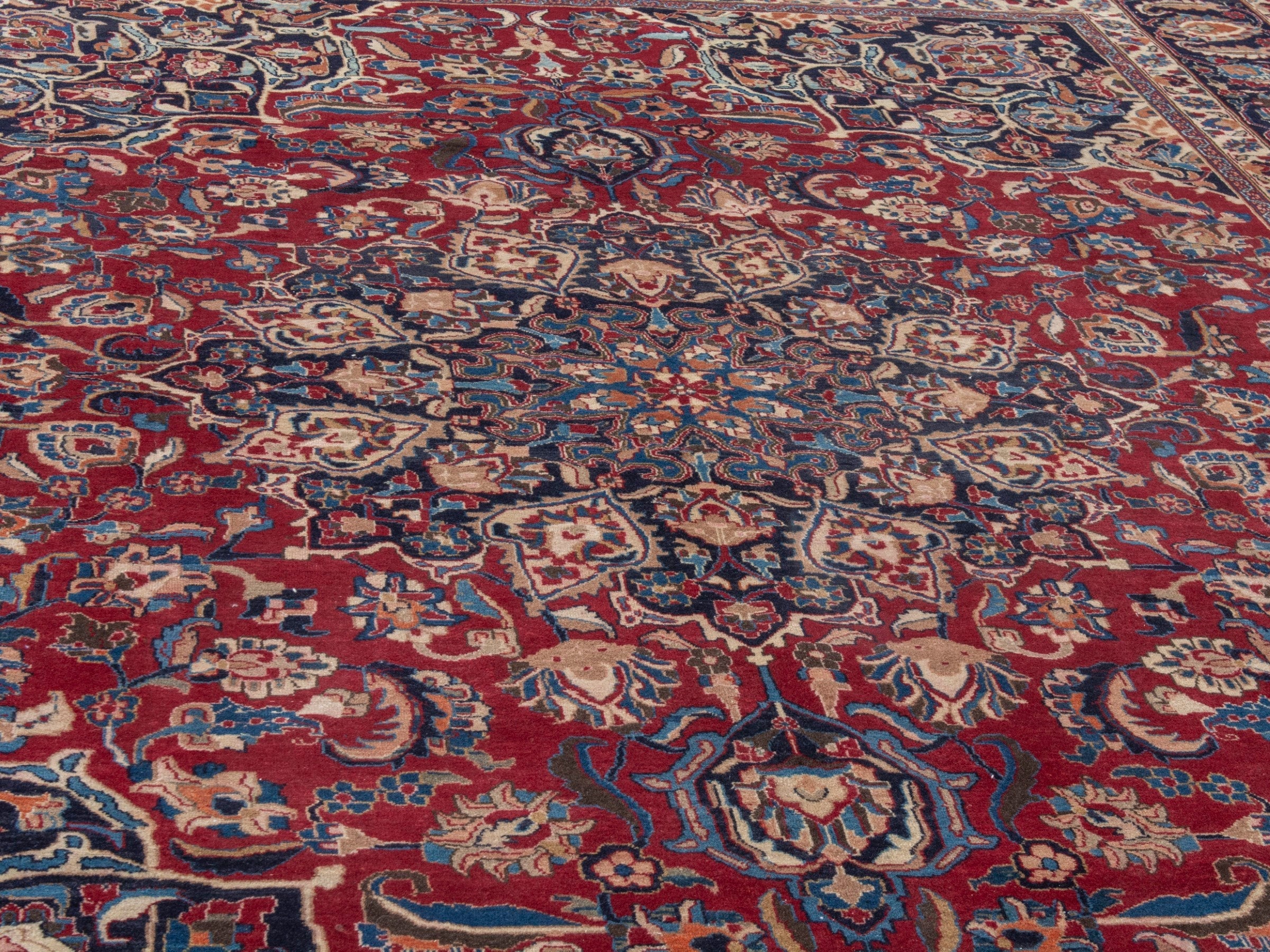 Persian Mashhad oversized rug in deep red and navy, view 8 of 22