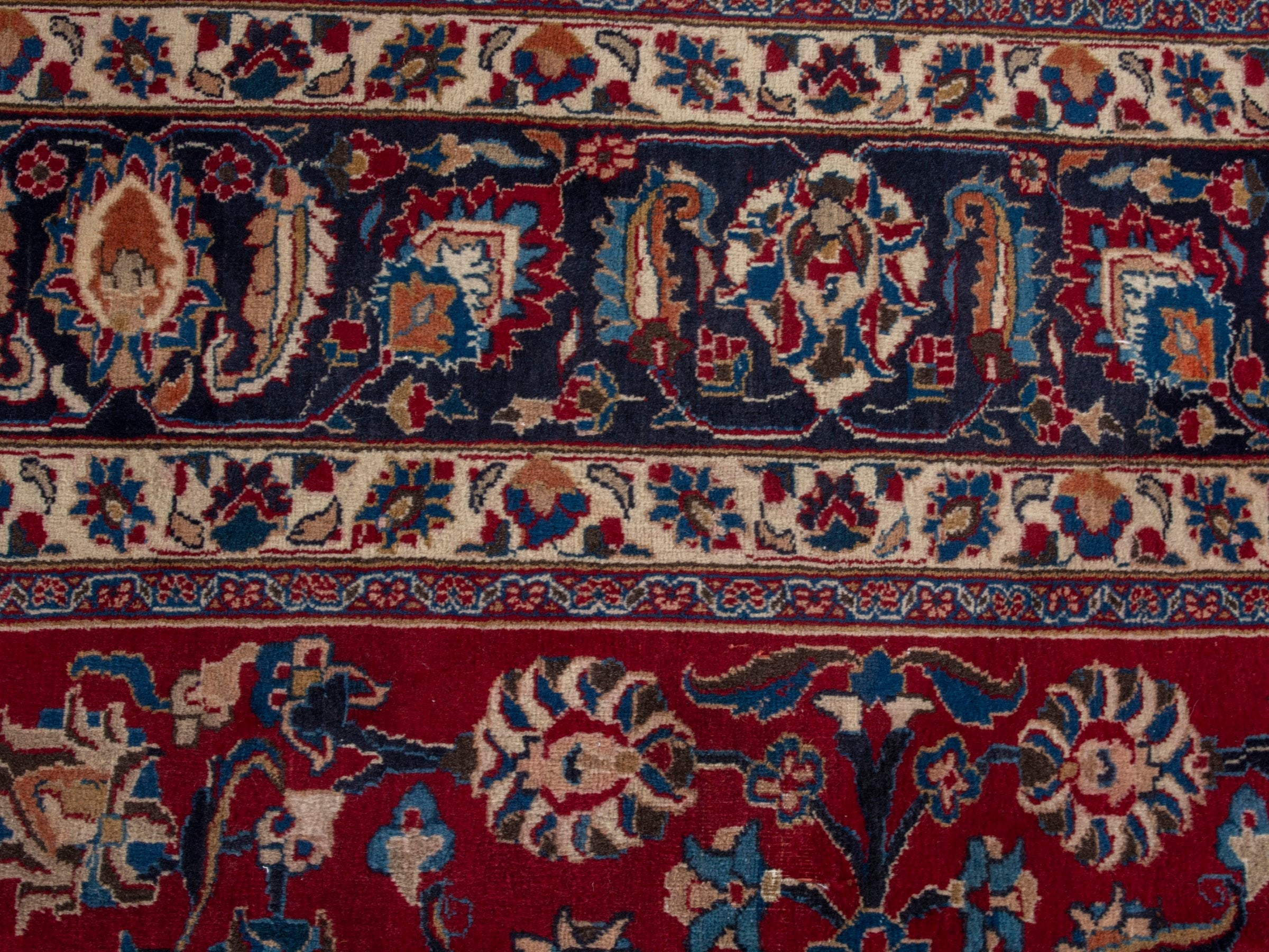 Persian Mashhad oversized rug in deep red and navy, view 16 of 22