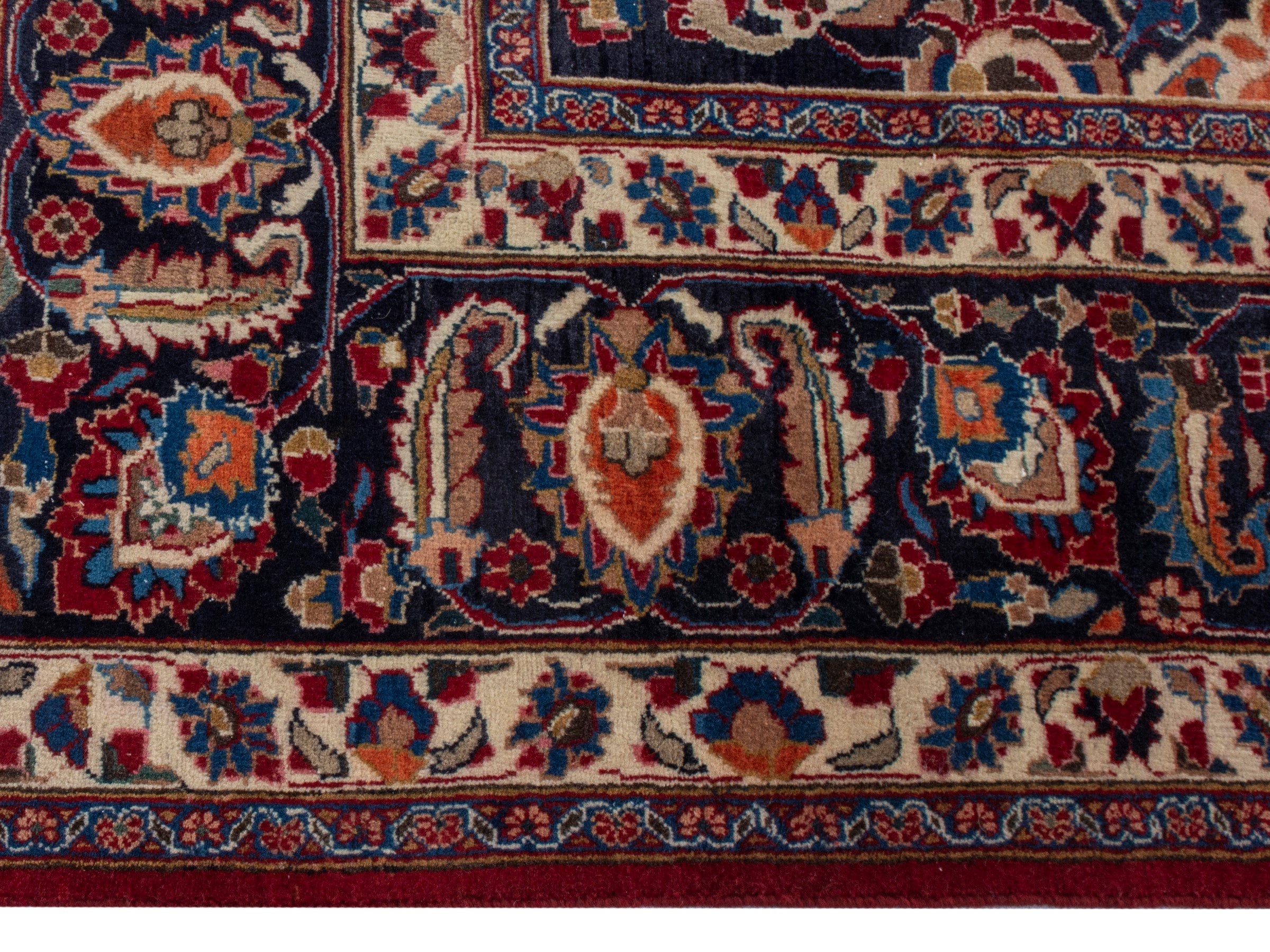 Persian Mashhad oversized rug in deep red and navy, view 10 of 22
