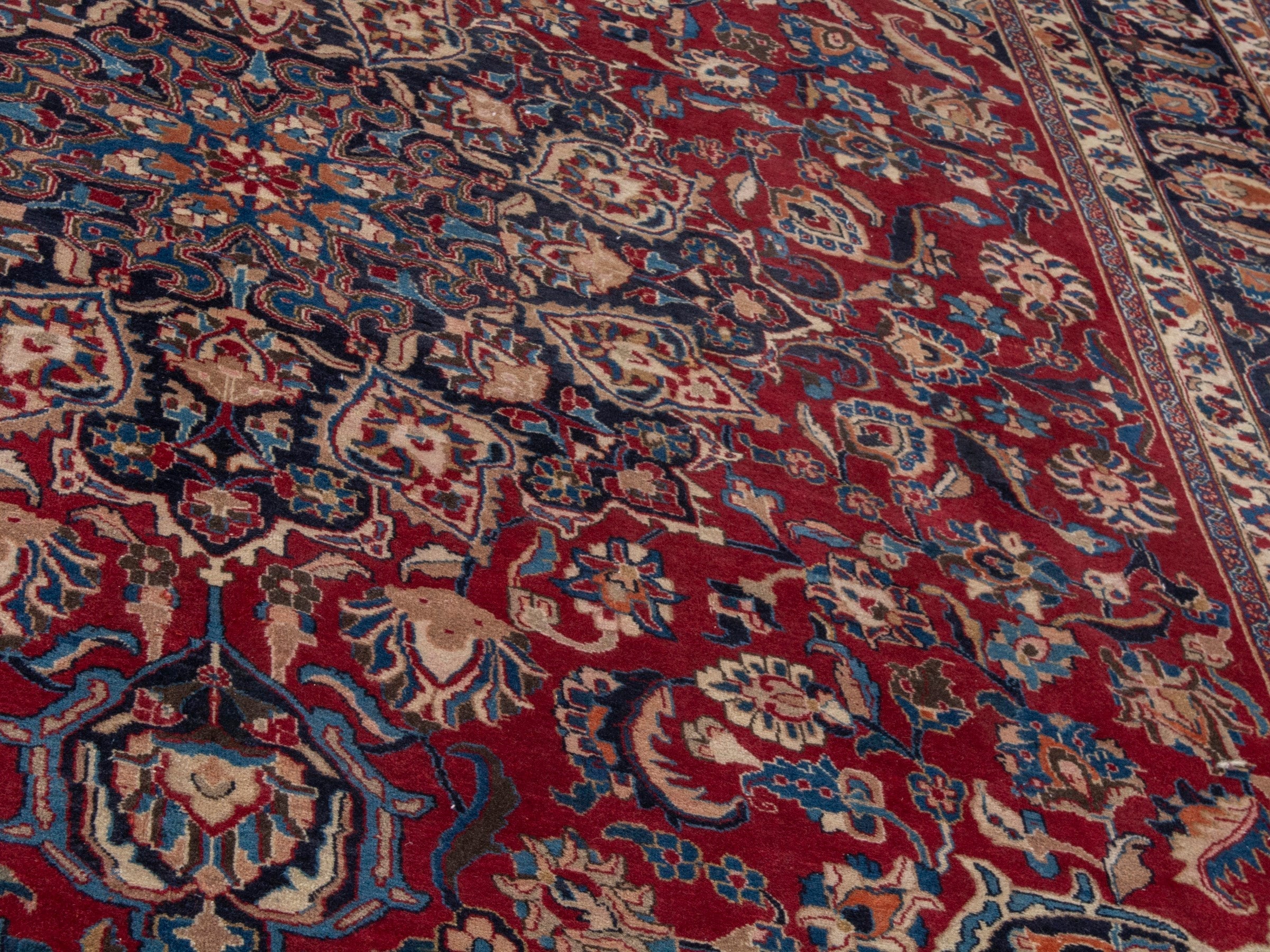 Persian Mashhad oversized rug in deep red and navy, view 9 of 22