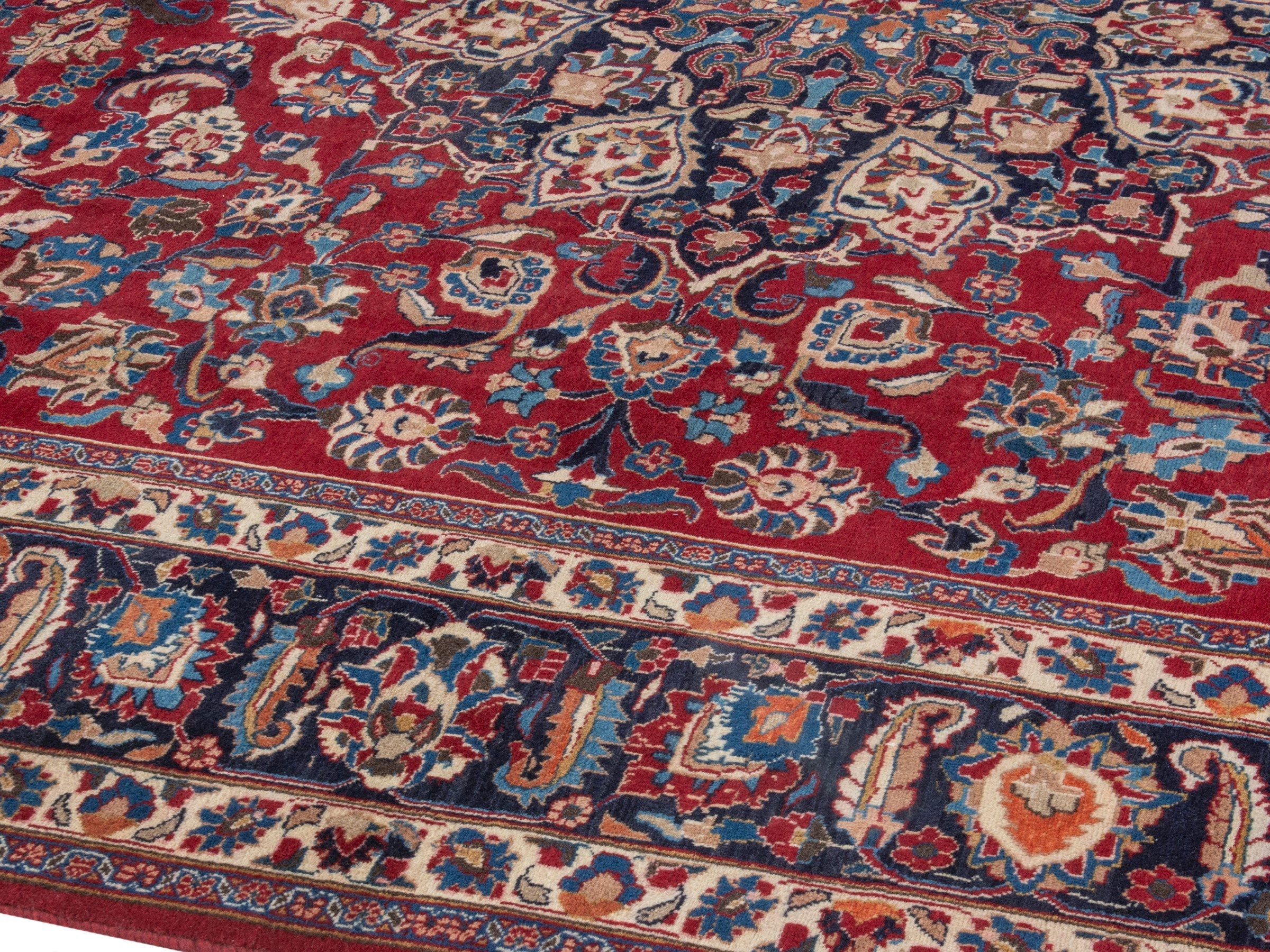 Persian Mashhad oversized rug in deep red and navy, view 6 of 22