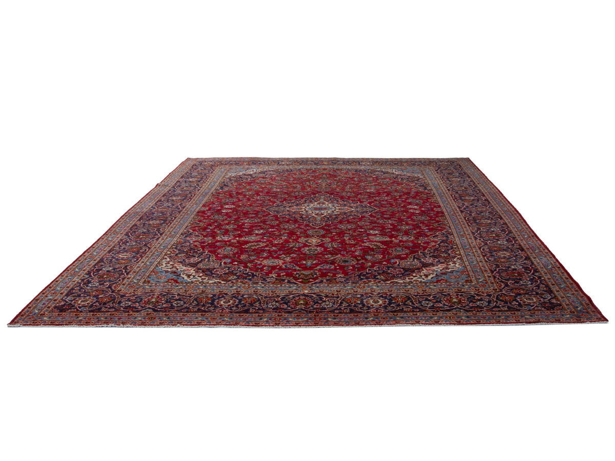 Persian Kashan oversized rug in deep red and navy, view 3 of 20