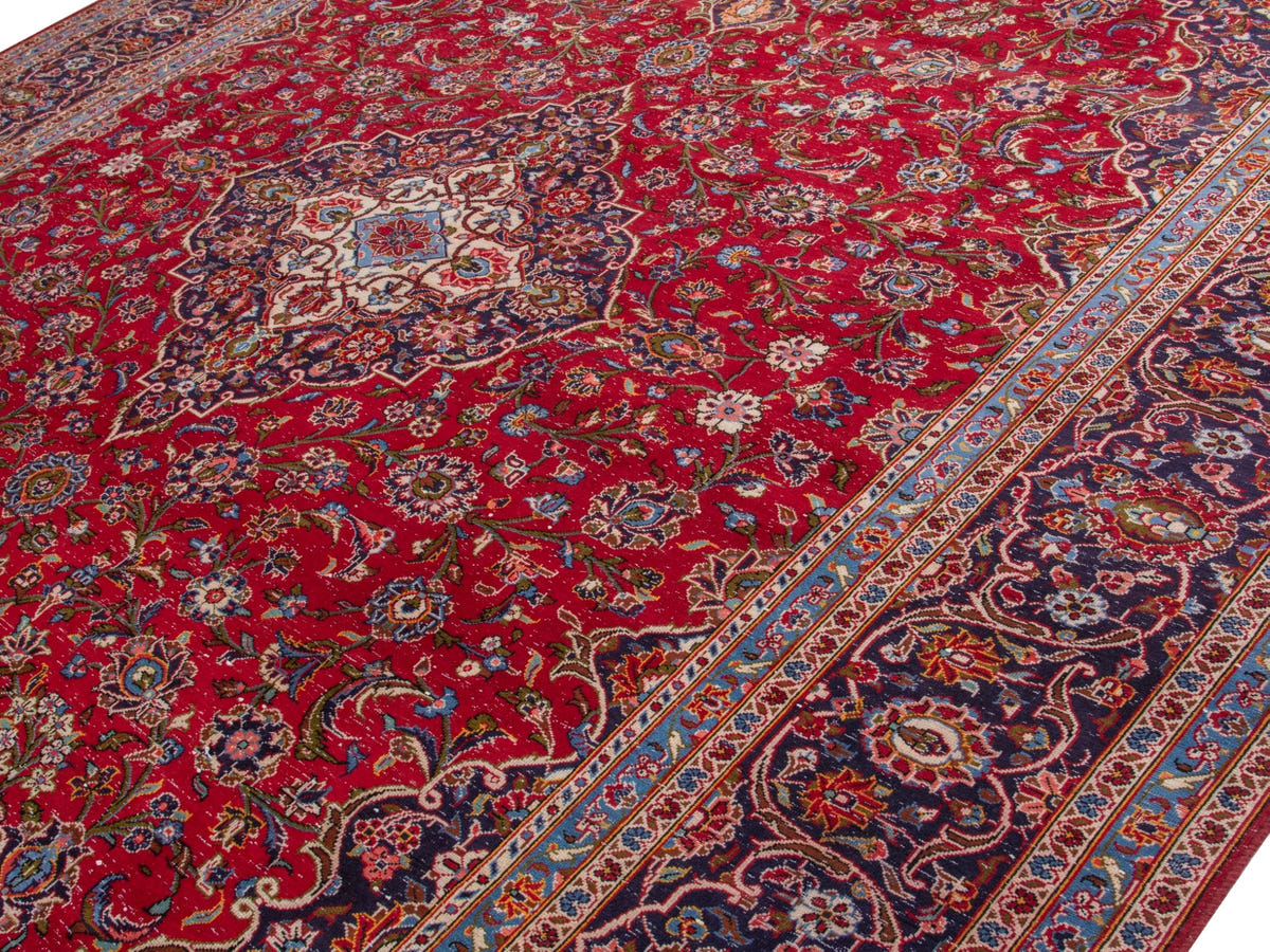 Persian Kashan oversized rug in deep red and navy, view 5 of 20