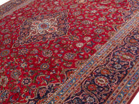 Persian Kashan oversized rug in deep red and navy, view 5 of 20