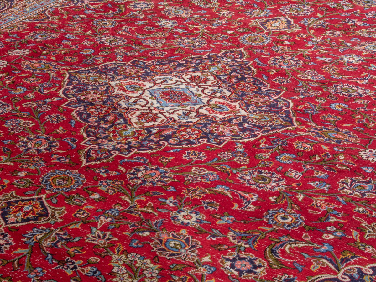 Persian Kashan oversized rug in deep red and navy, view 10 of 20