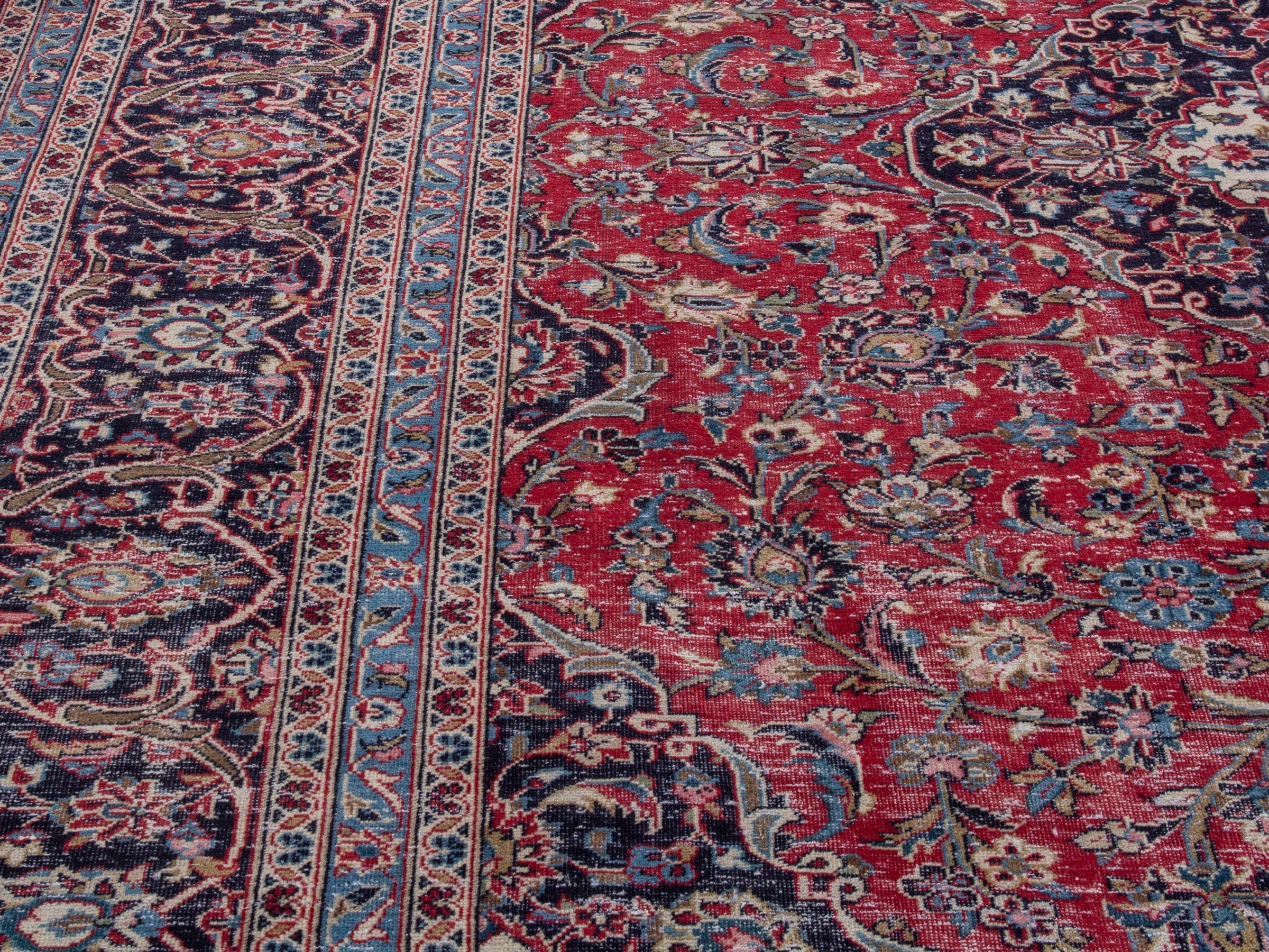 Persian Kashan oversized rug in deep red and dark brown, view 9 of 21