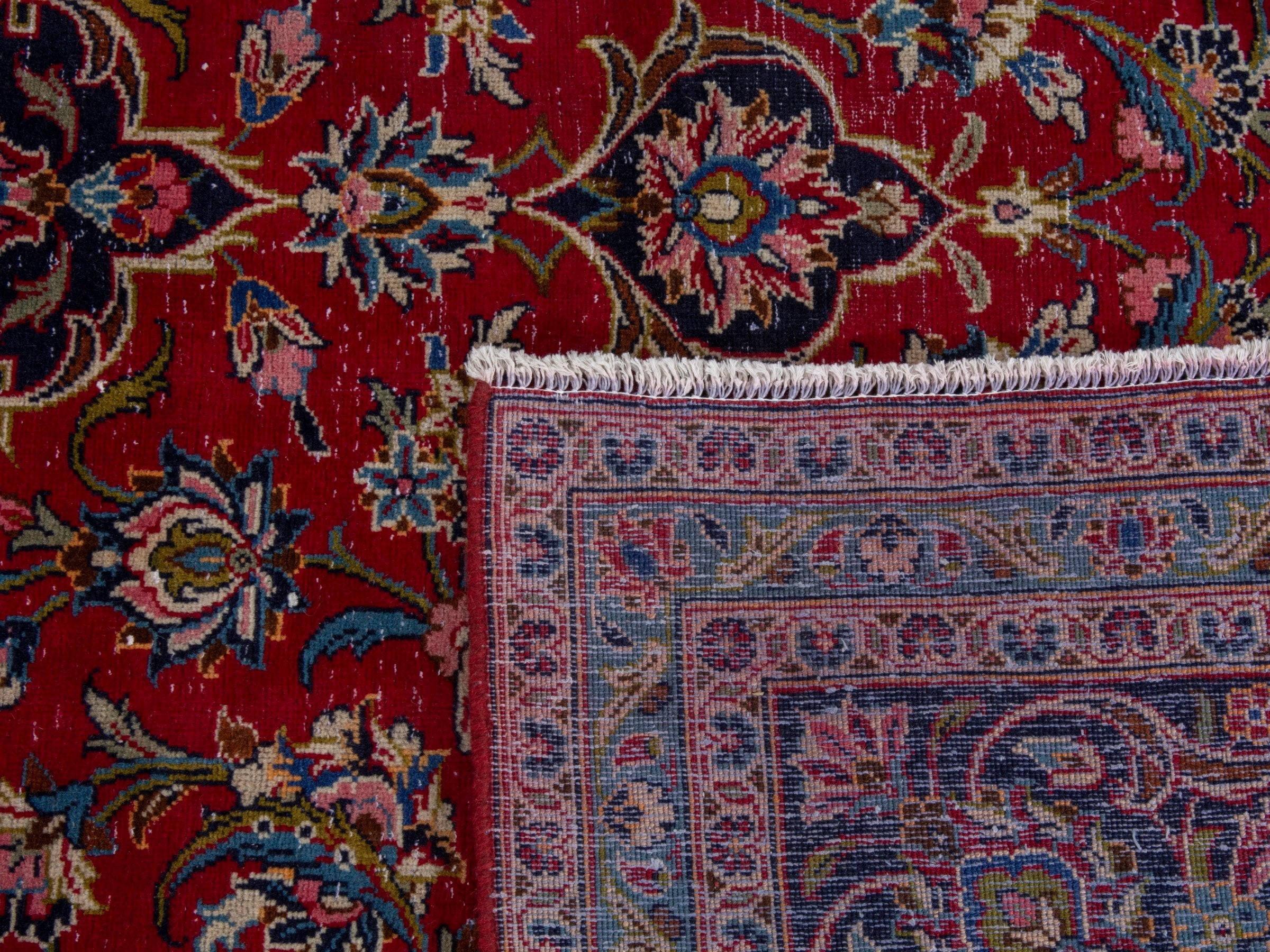 Persian Kashan oversized rug in deep red and dark blue, view 22 of 22