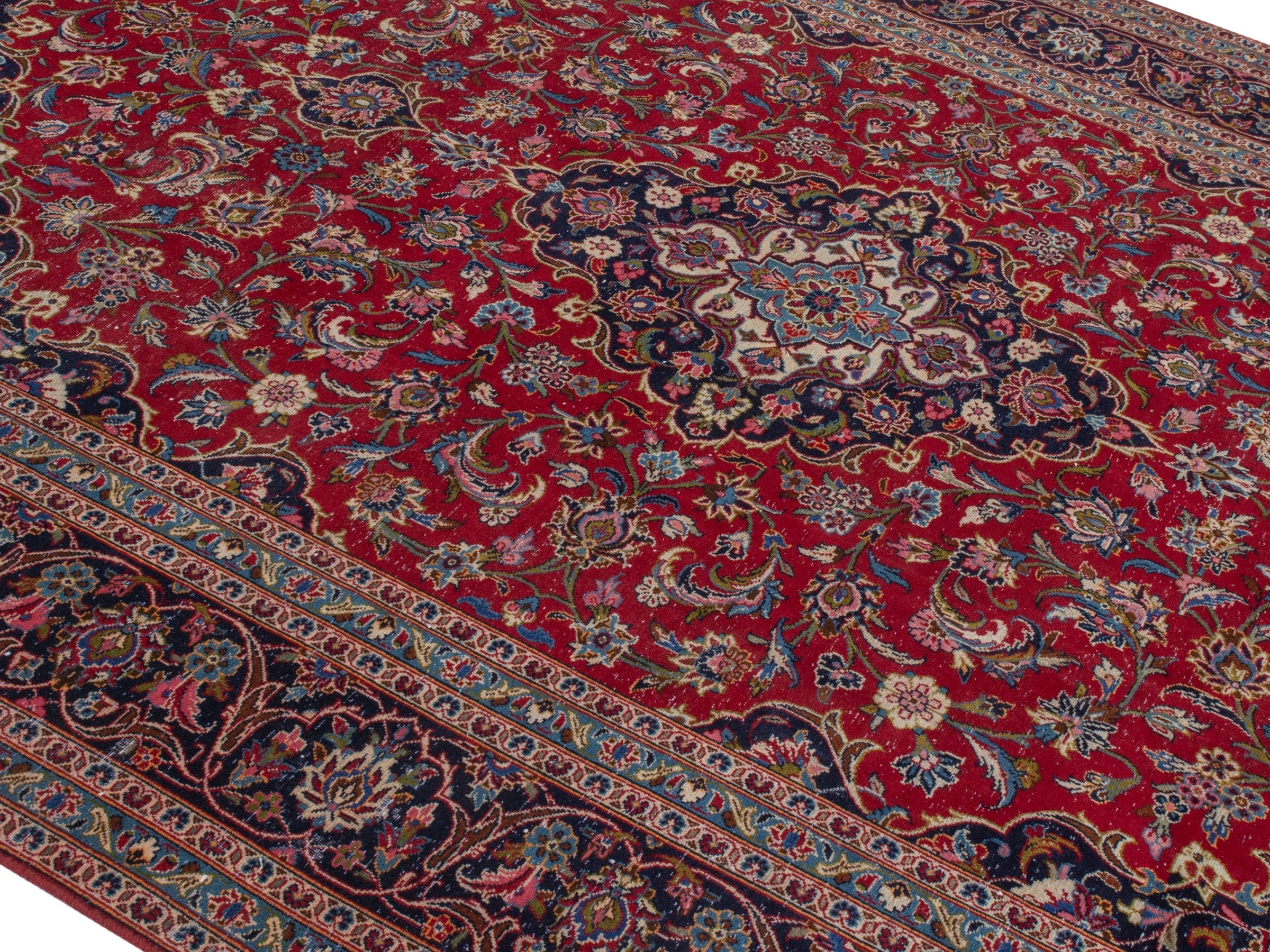 Persian Kashan oversized rug in deep red and dark blue, view 4 of 22