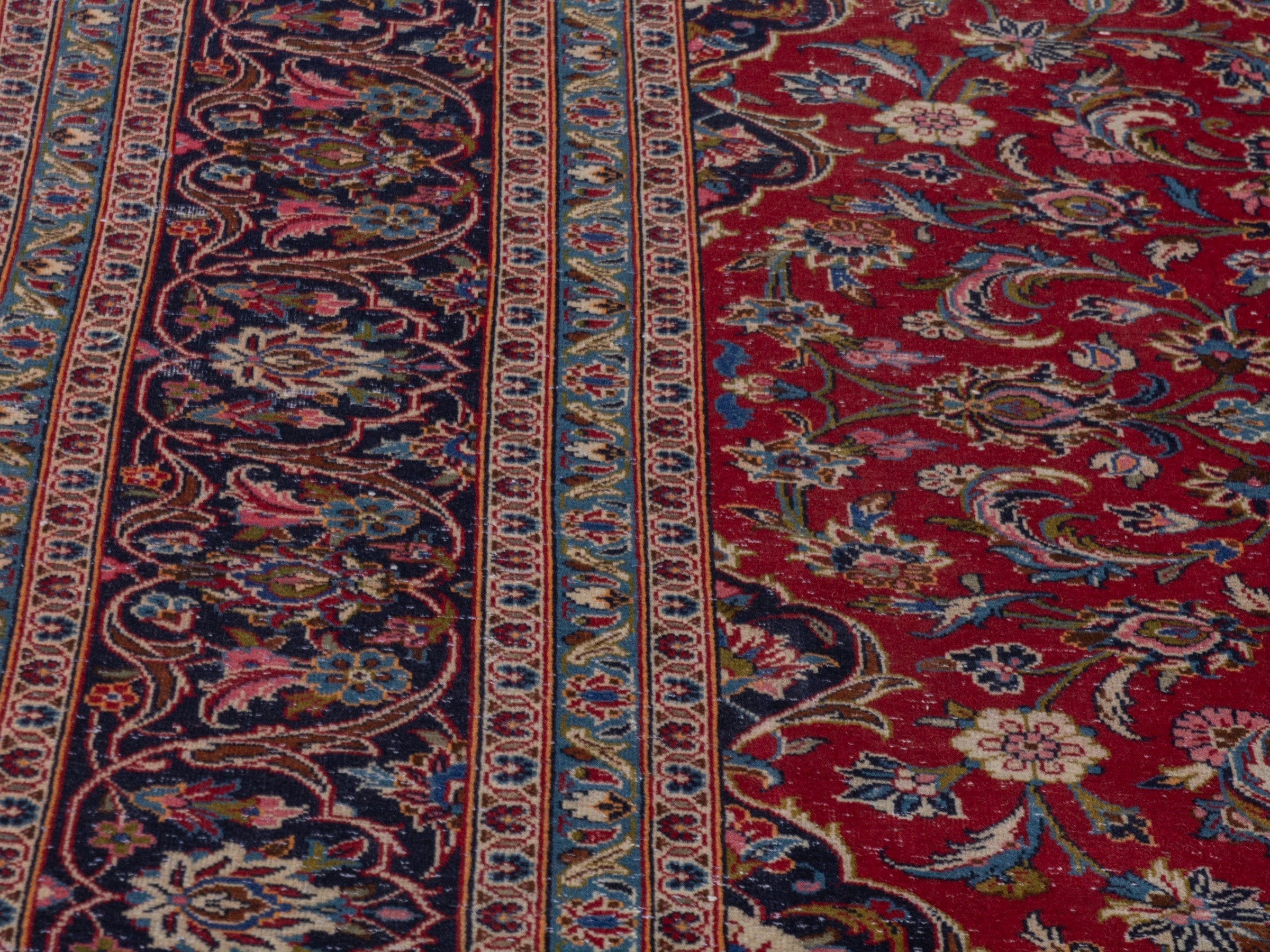 Persian Kashan oversized rug in deep red and dark blue, view 9 of 22