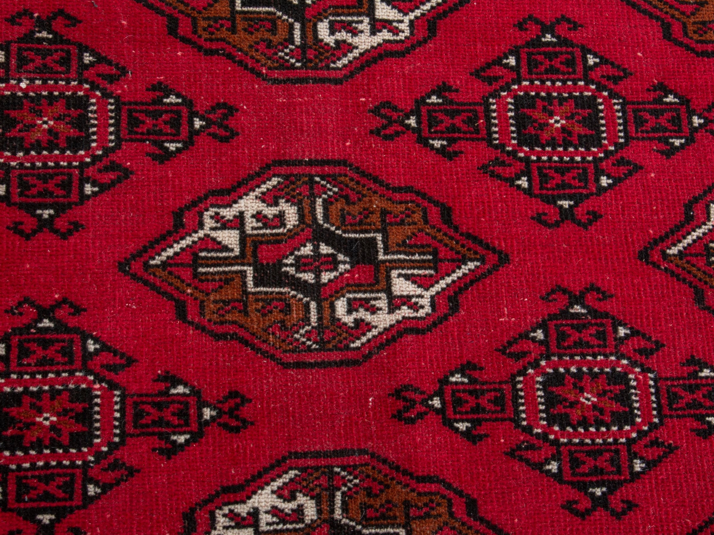 Persian Torkaman oversized rug in deep red and antique gold, view 12 of 19