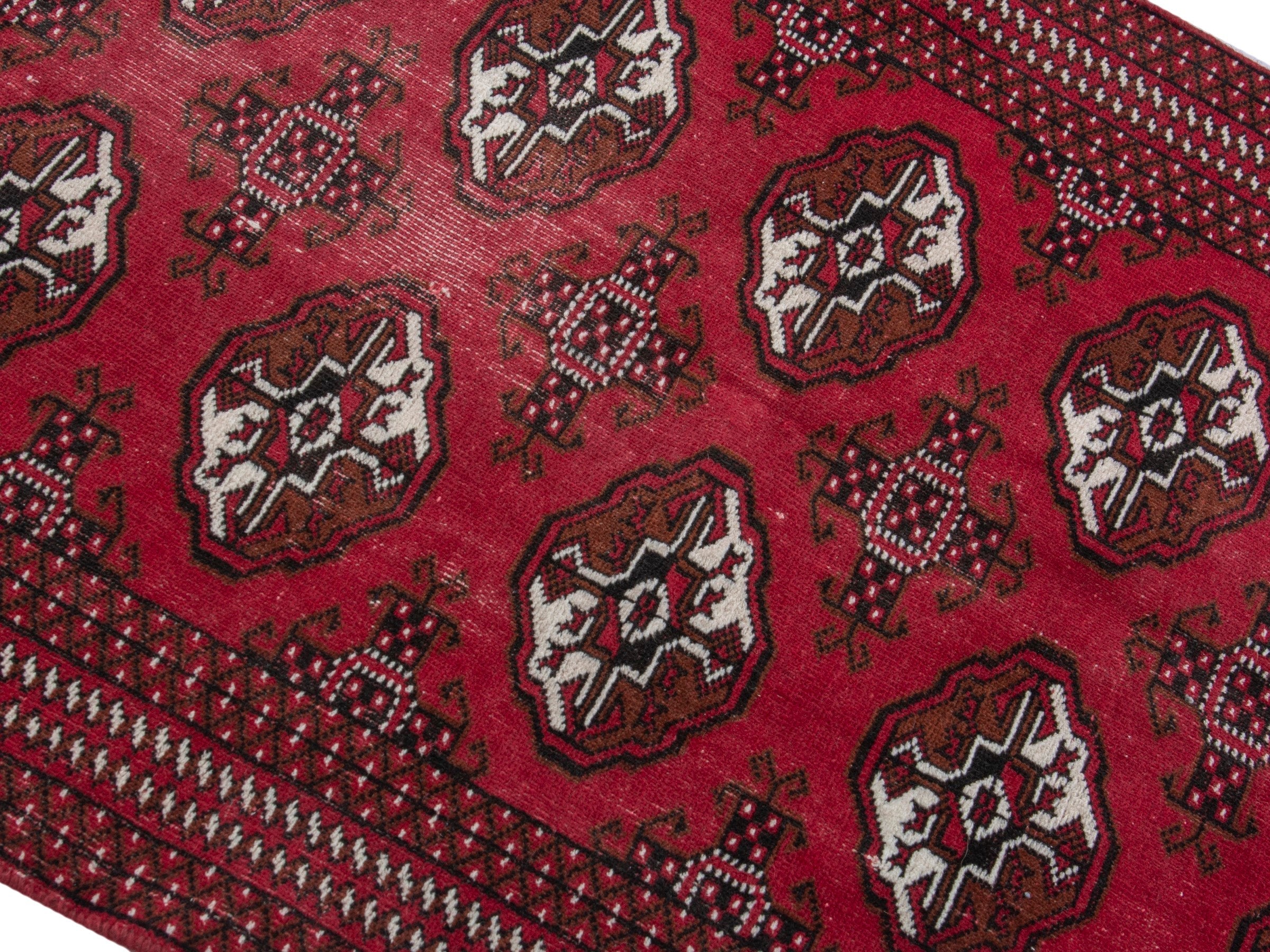 Persian Torkaman accent rug in burgundy and cream, view 10 of 17