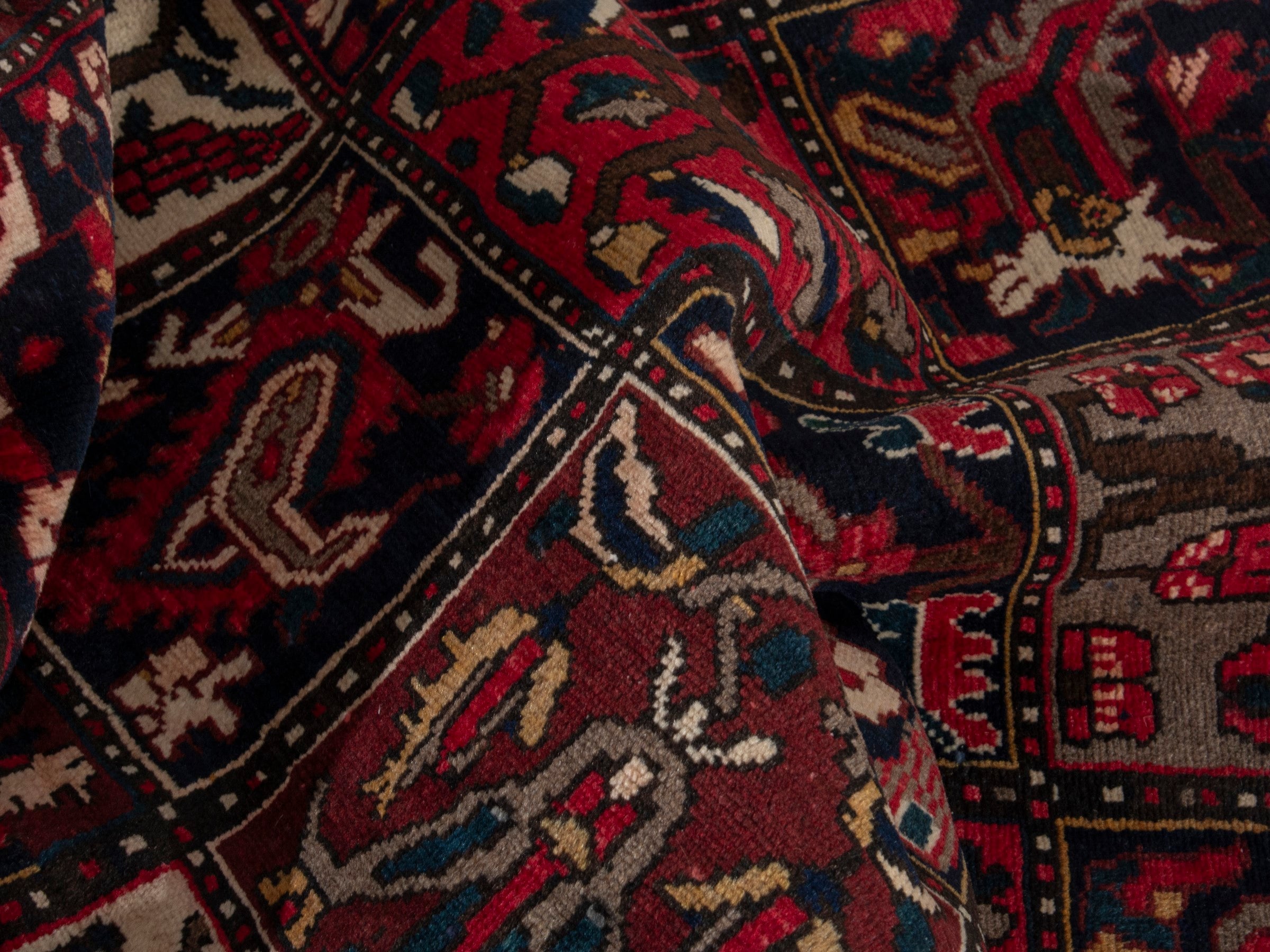 Persian Bakhtiari accent rug in deep red and navy, view 17 of 19