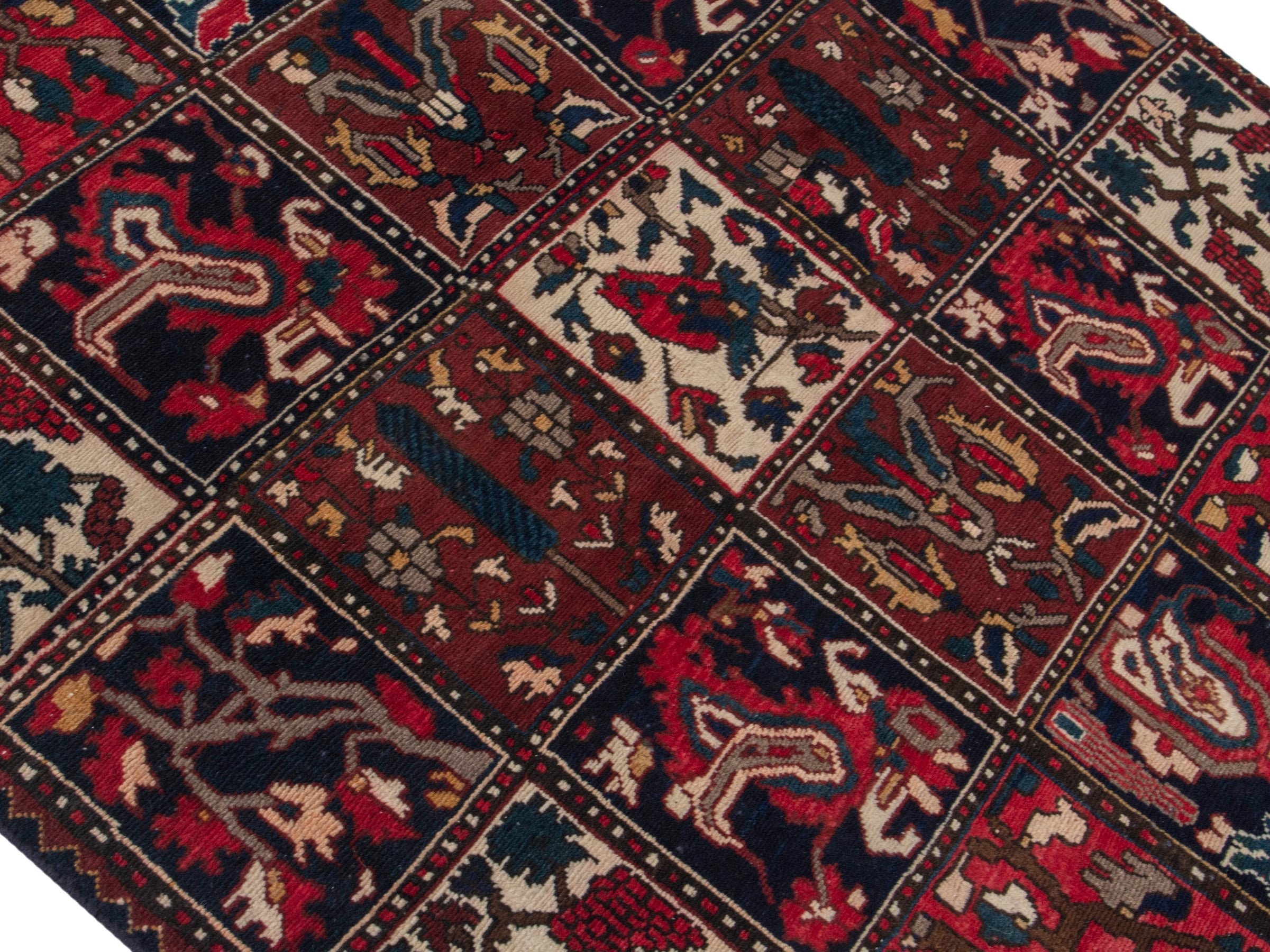Persian Bakhtiari accent rug in deep red and navy, view 4 of 19