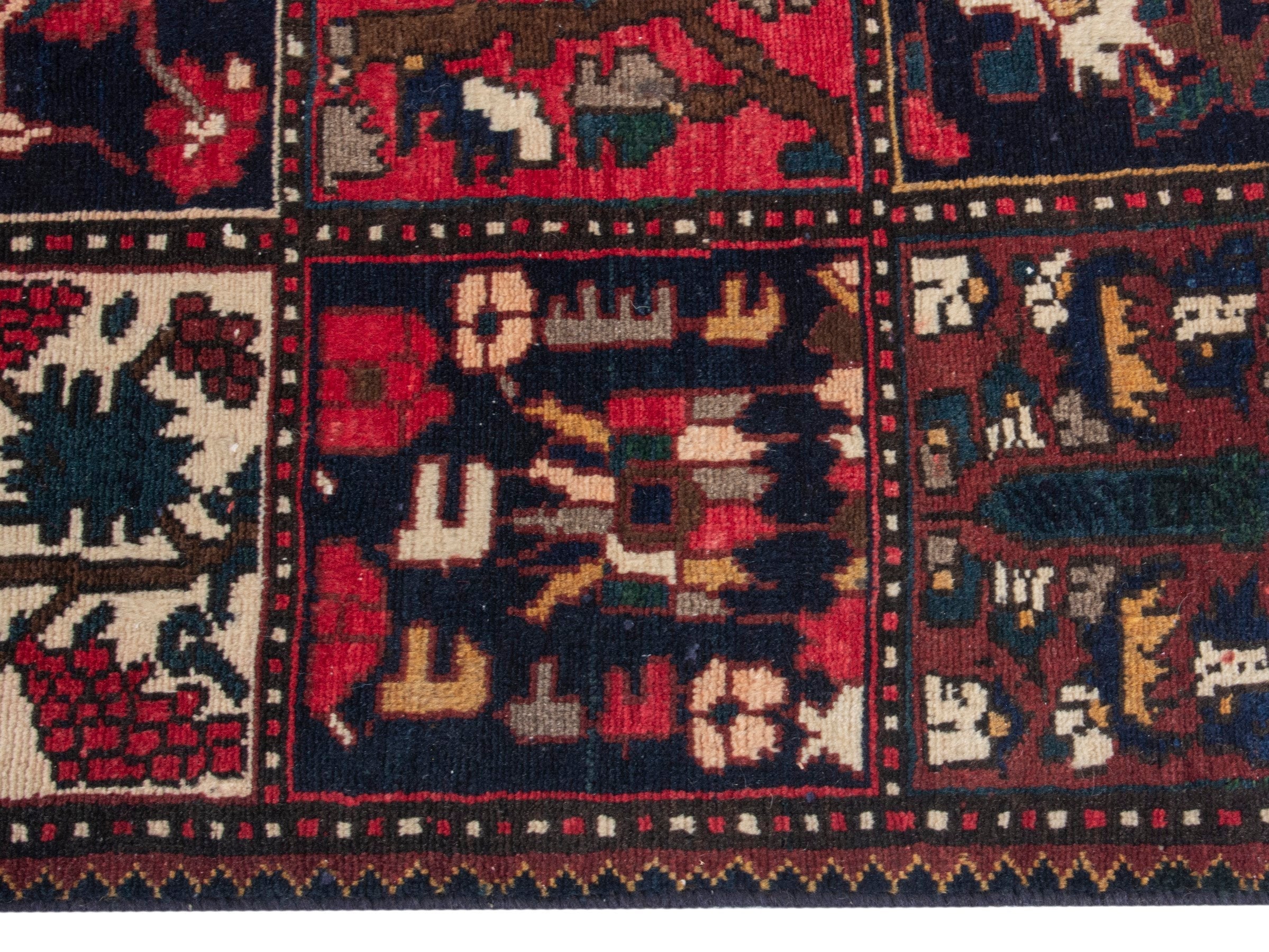 Persian Bakhtiari accent rug in deep red and navy, view 10 of 19
