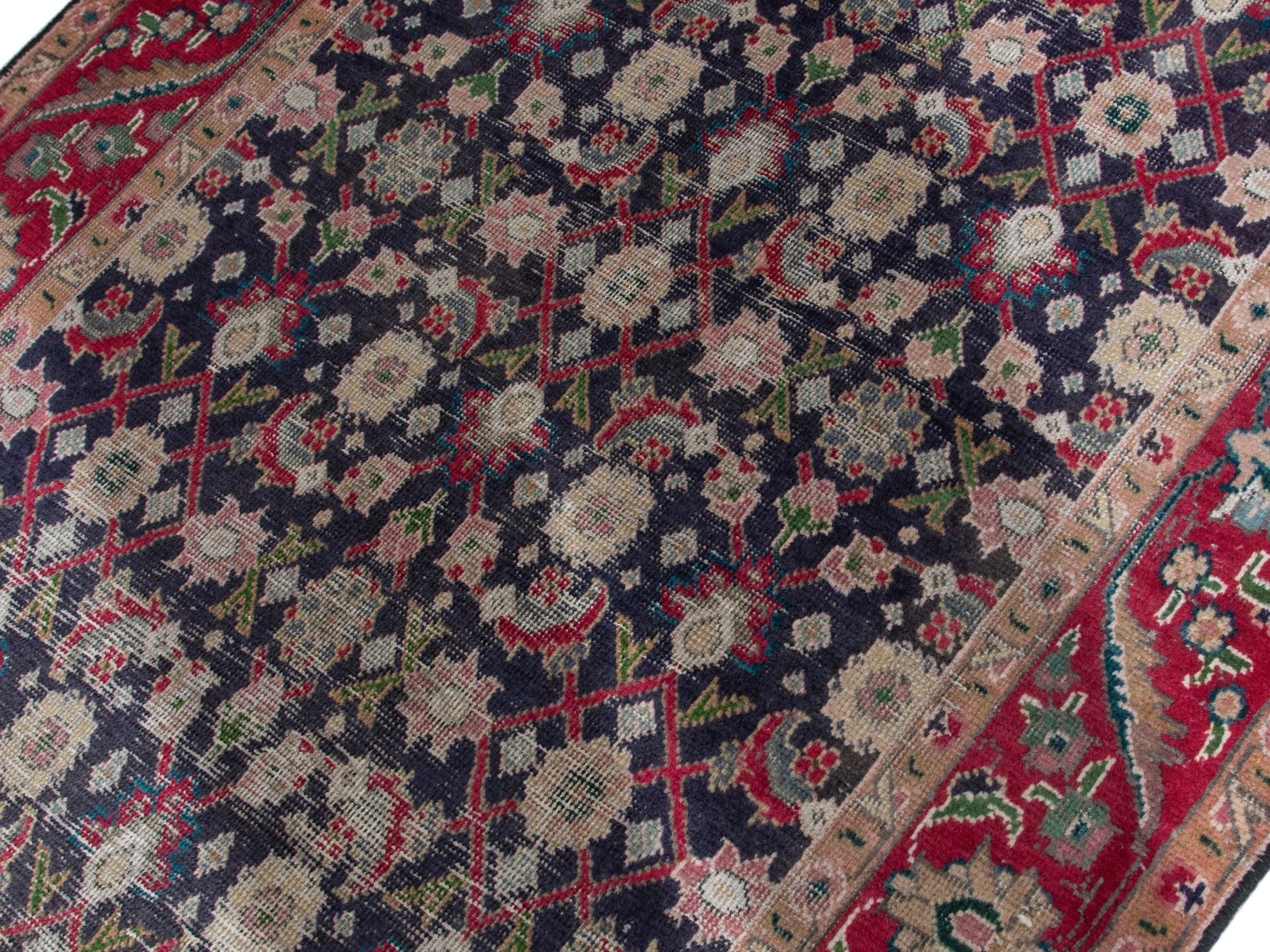 Persian Tabriz accent rug in navy and deep red, view 4 of 17