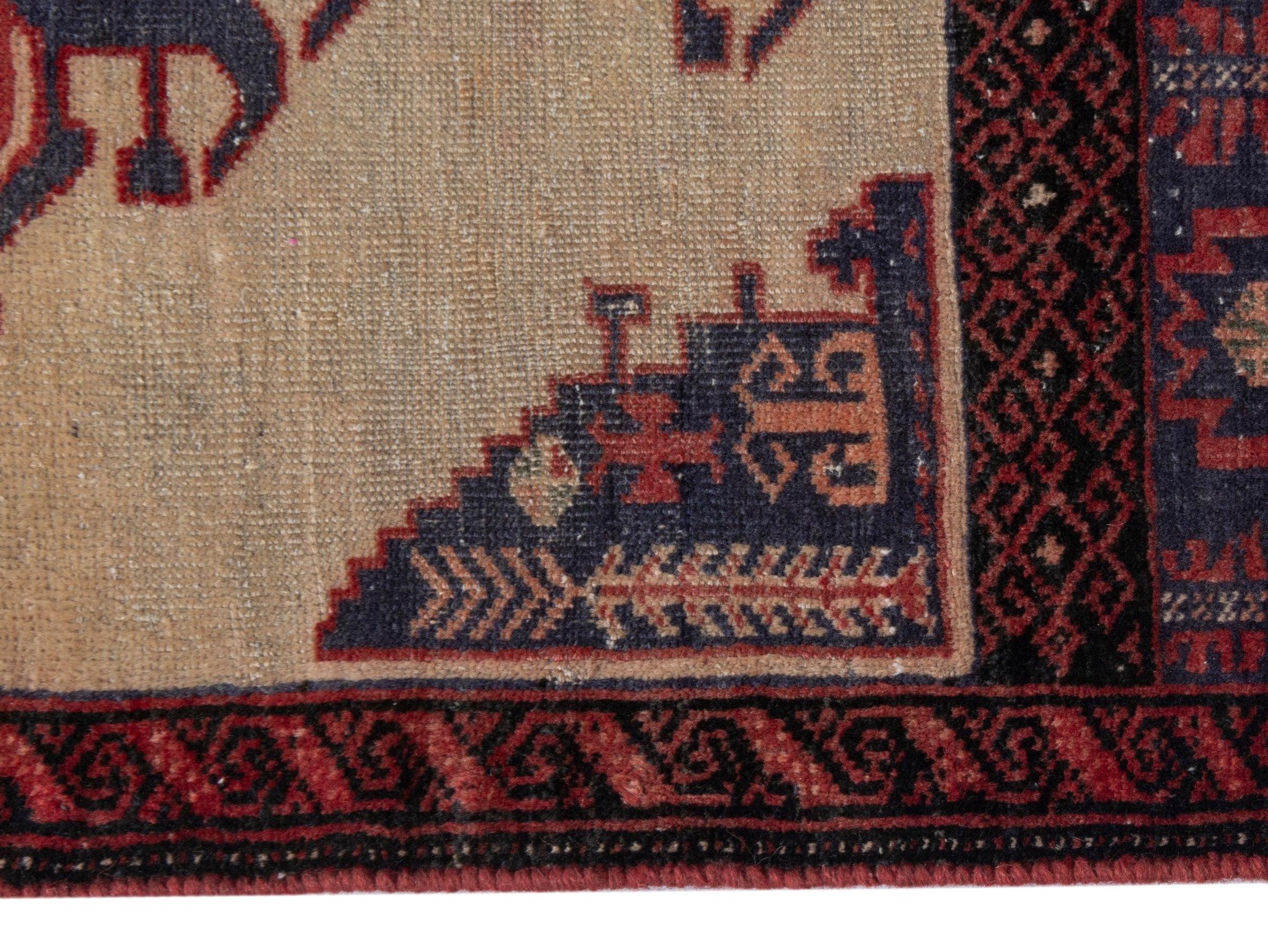 Persian Torkaman accent rug in cream and navy, view 10 of 17