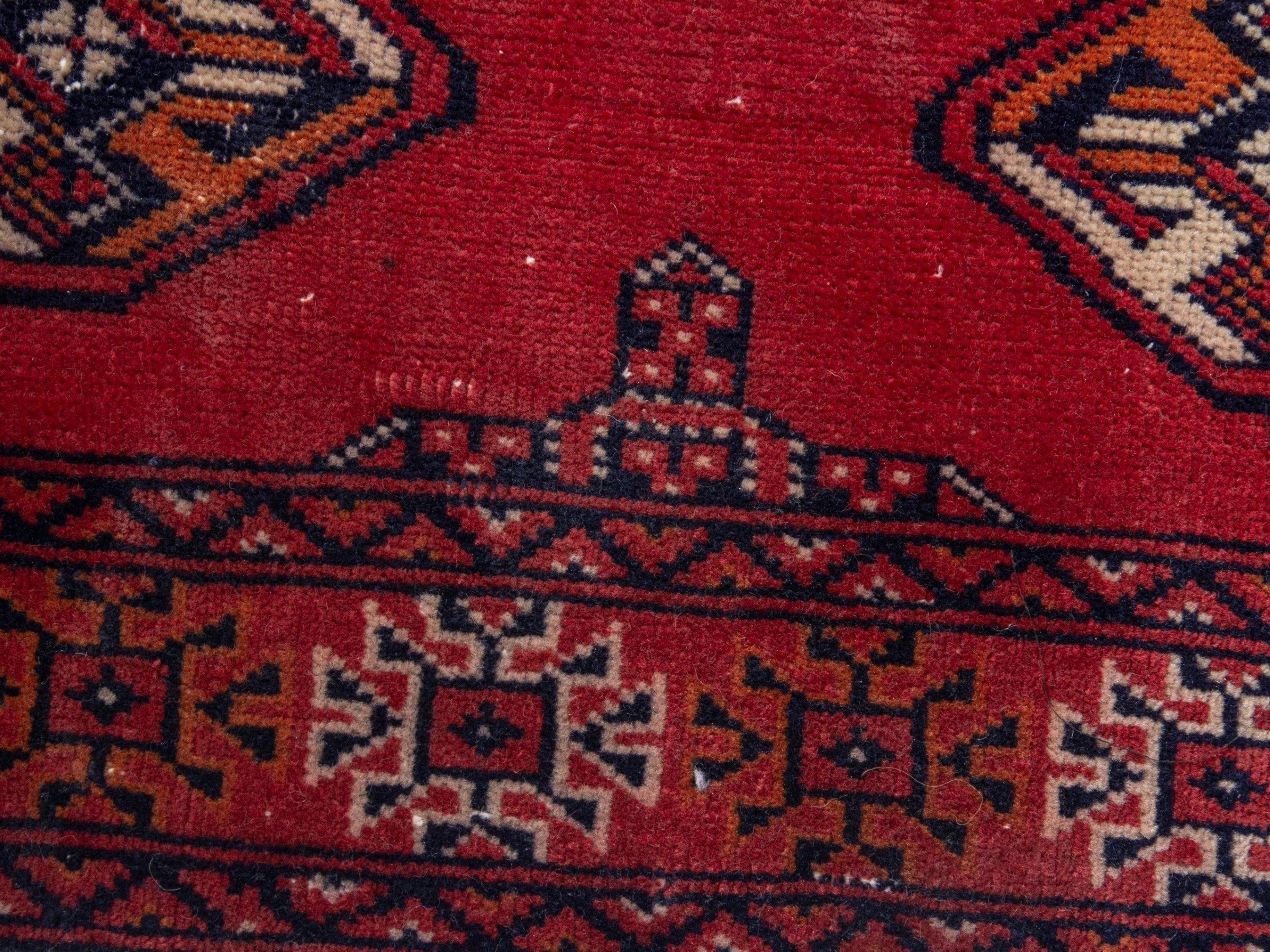 Persian Torkaman runner rug in deep red and cream, view 11 of 17