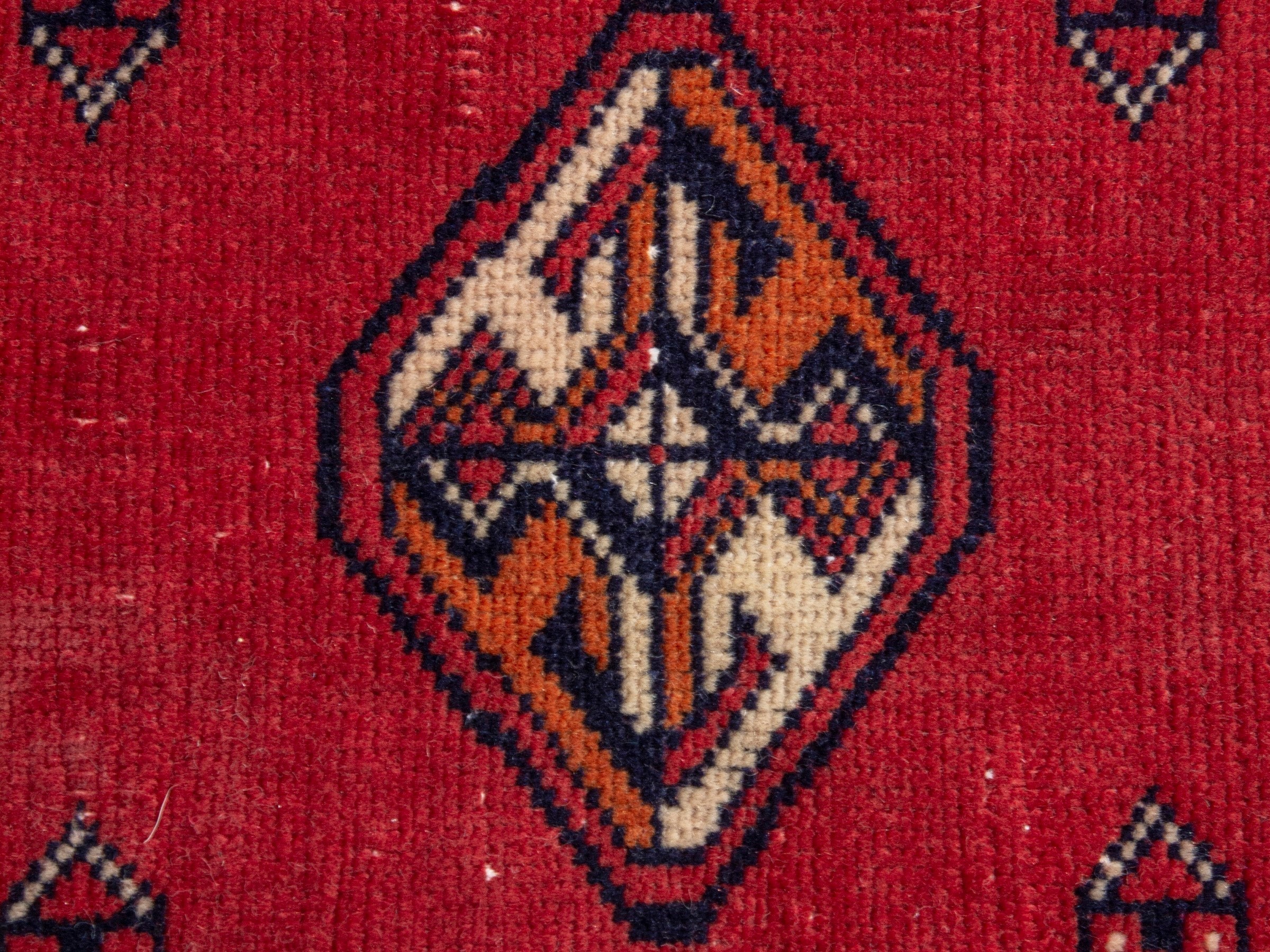 Persian Torkaman runner rug in deep red and cream, view 12 of 17