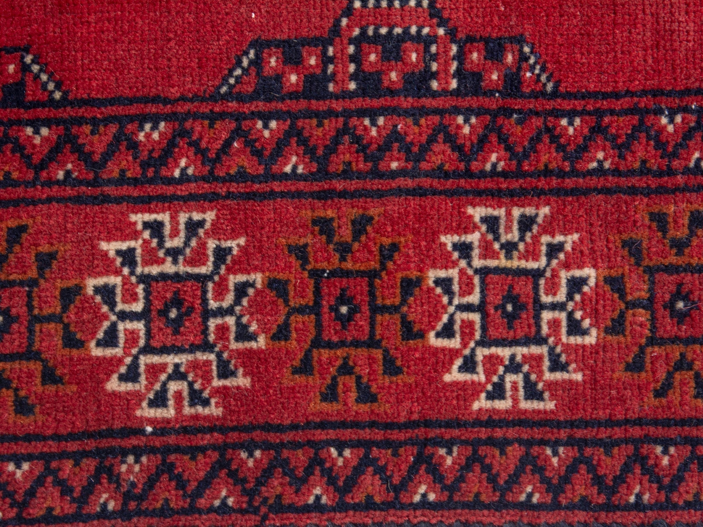 Persian Torkaman runner rug in deep red and cream, view 13 of 17