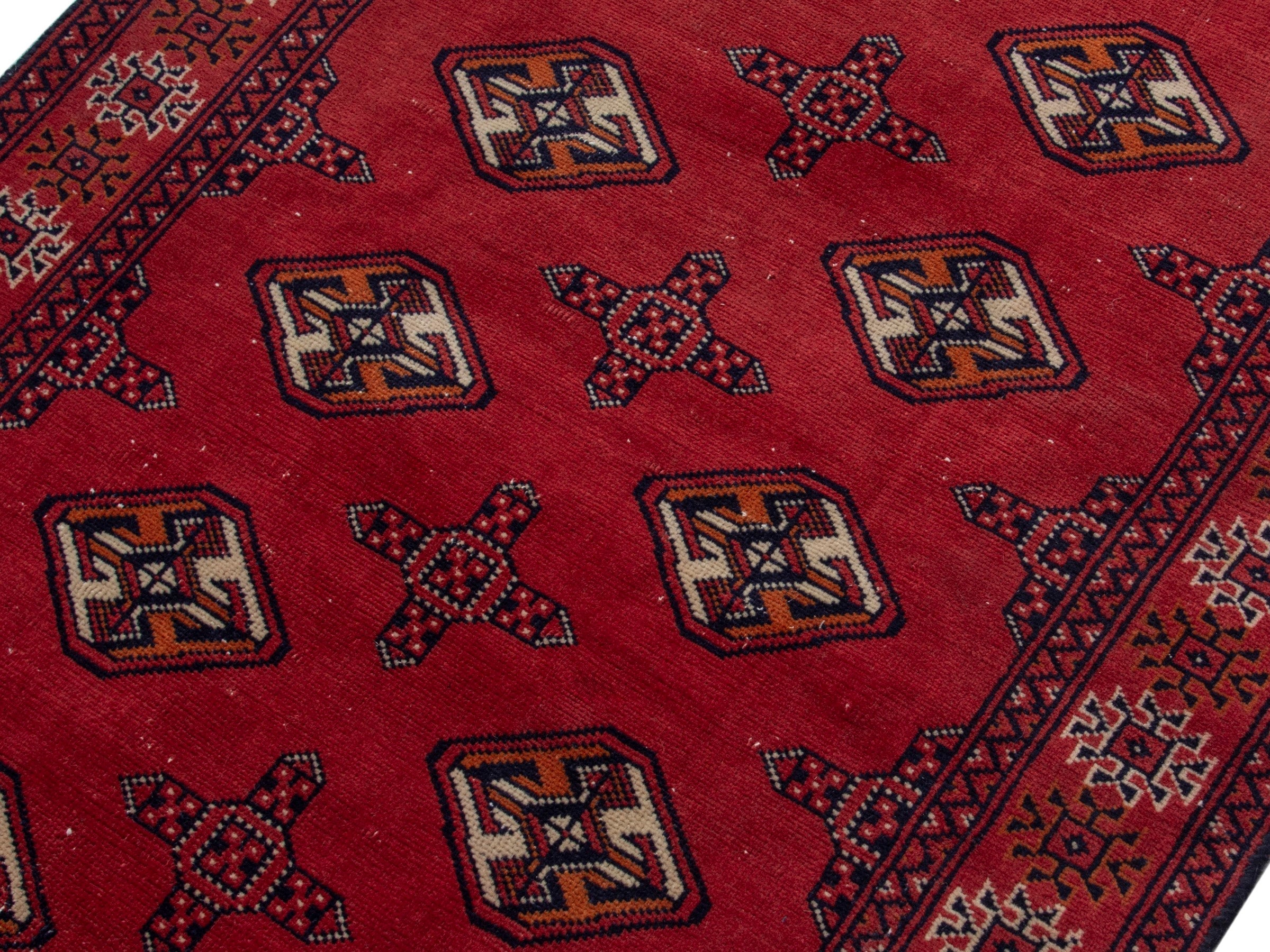 Persian Torkaman runner rug in deep red and cream, view 4 of 17