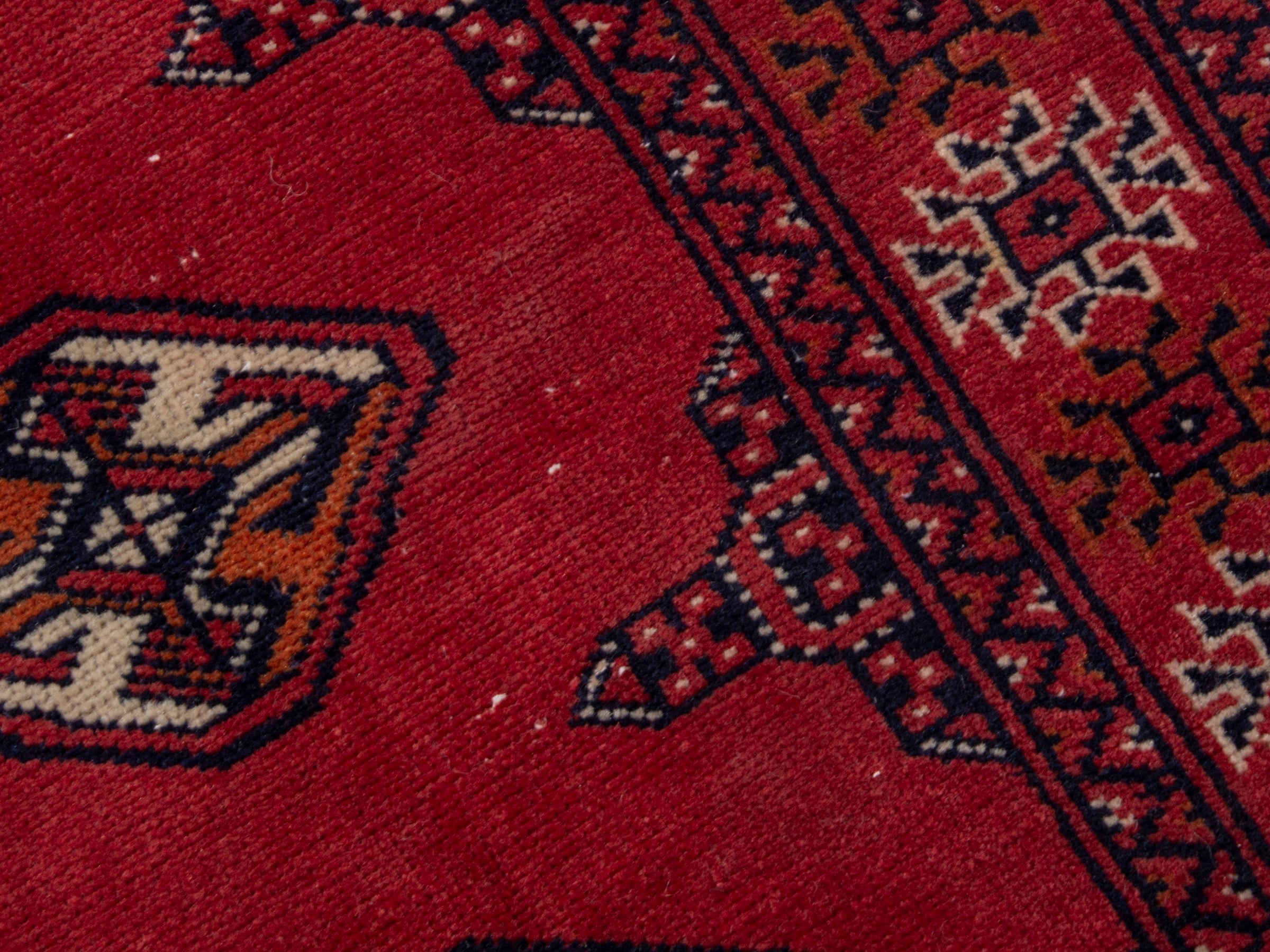 Persian Torkaman runner rug in deep red and cream, view 9 of 17