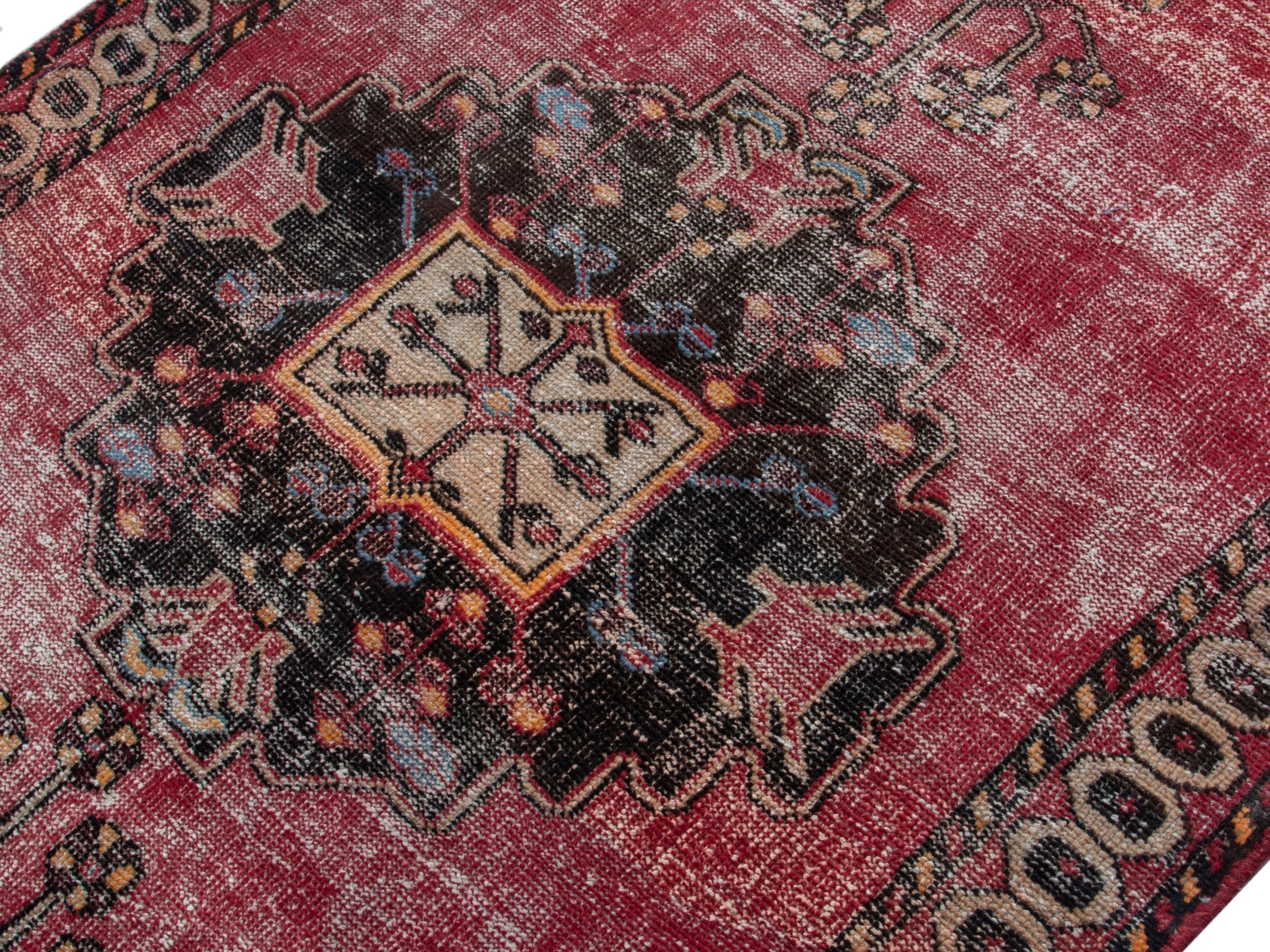 Persian Ferdos accent rug in dusty rose and black cherry, view 4 of 18