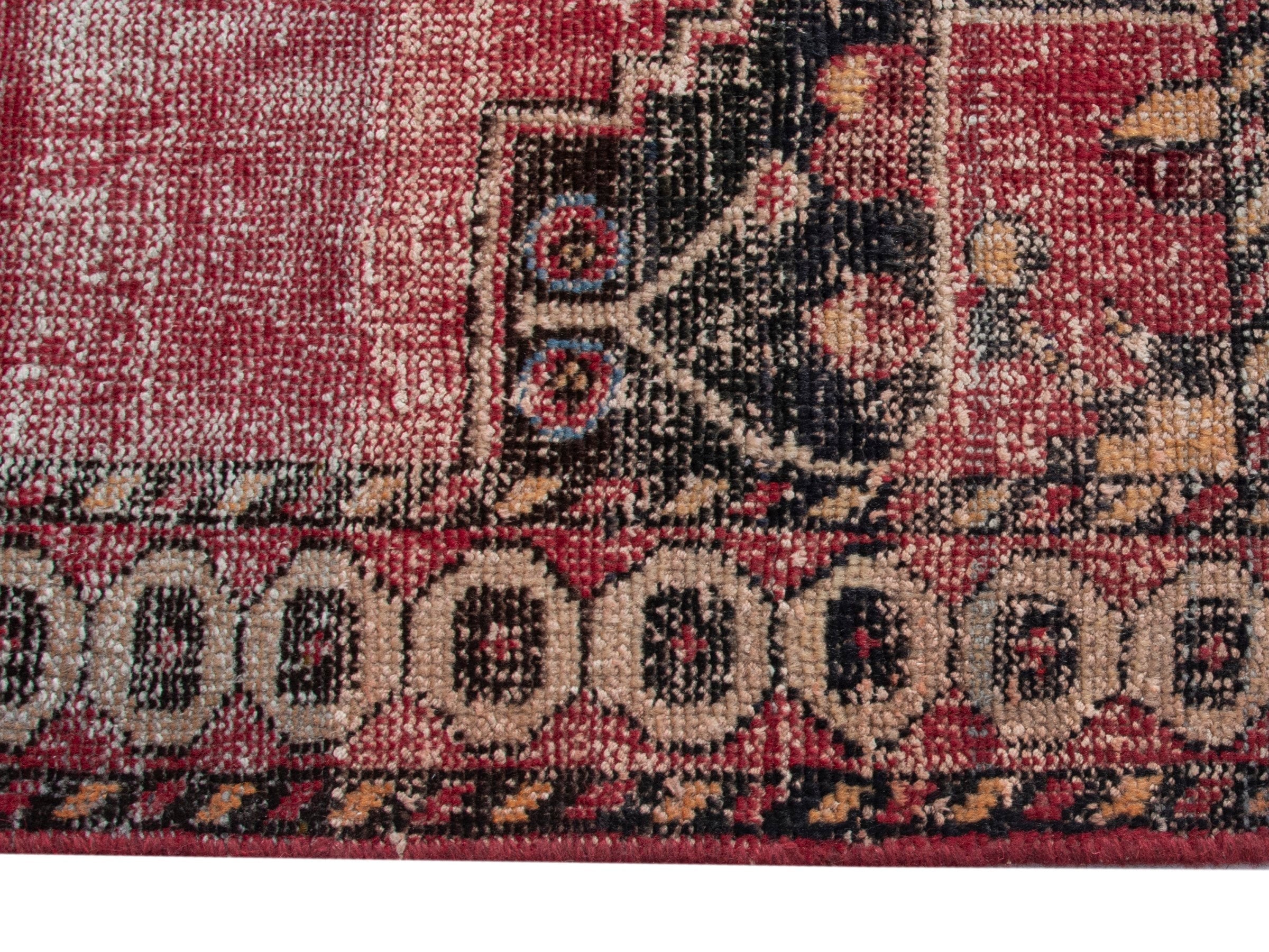 Persian Ferdos accent rug in dusty rose and black cherry, view 10 of 18