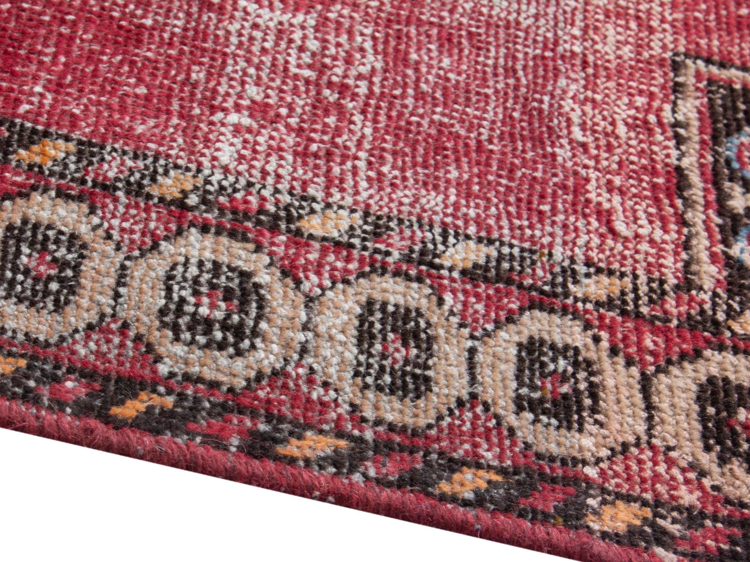 Persian Ferdos accent rug in dusty rose and black cherry, view 6 of 18