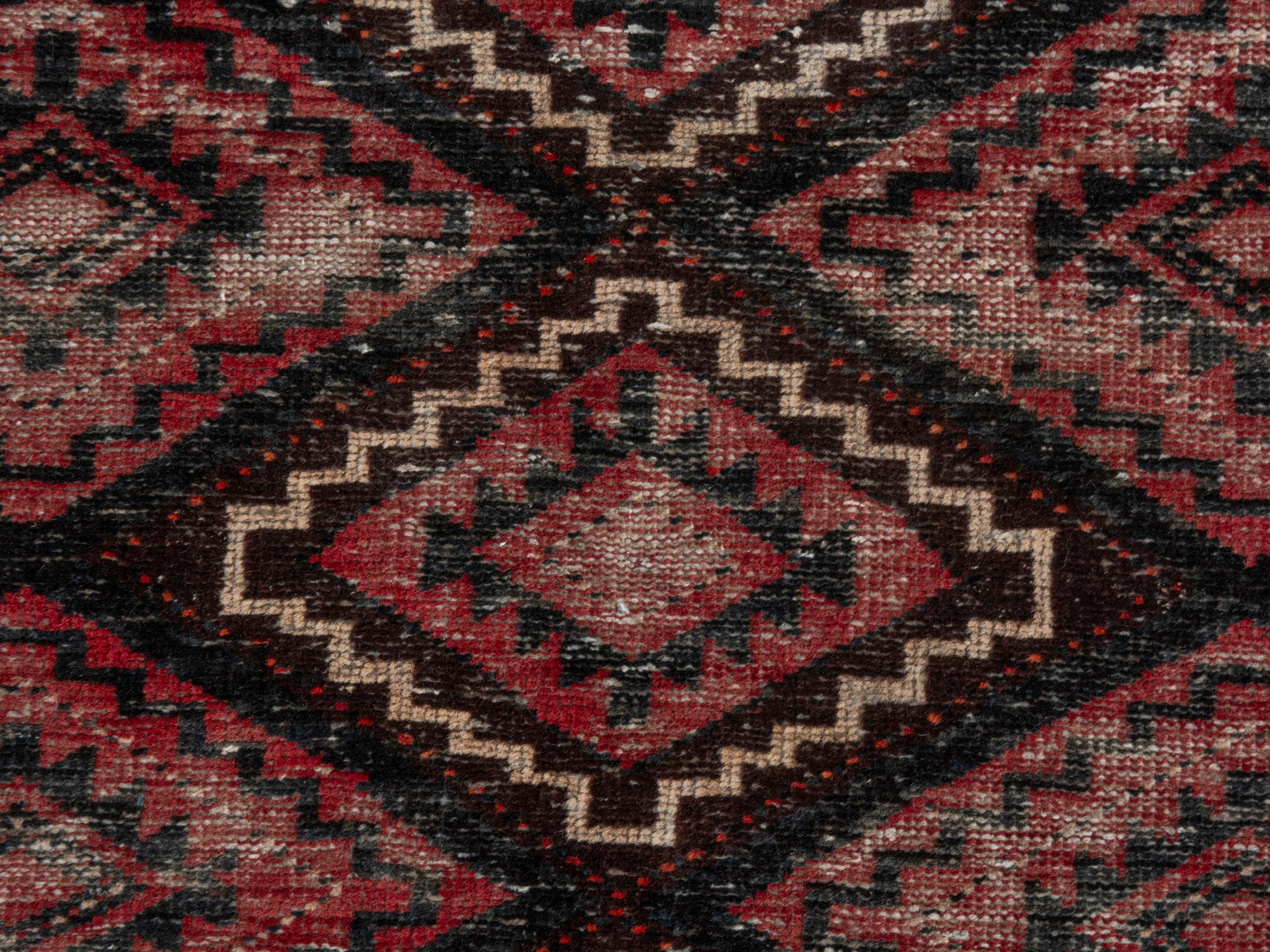 Persian Baluch runner rug in deep red and burgundy, view 12 of 18