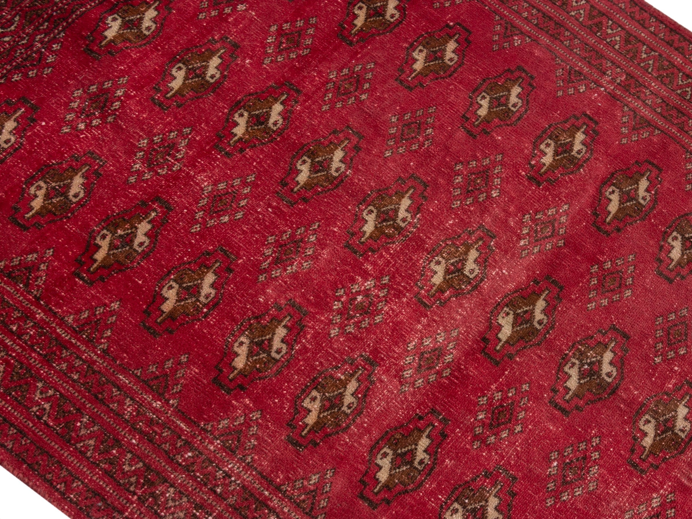 Persian Torkaman accent rug in deep red and gold, view 4 of 17
