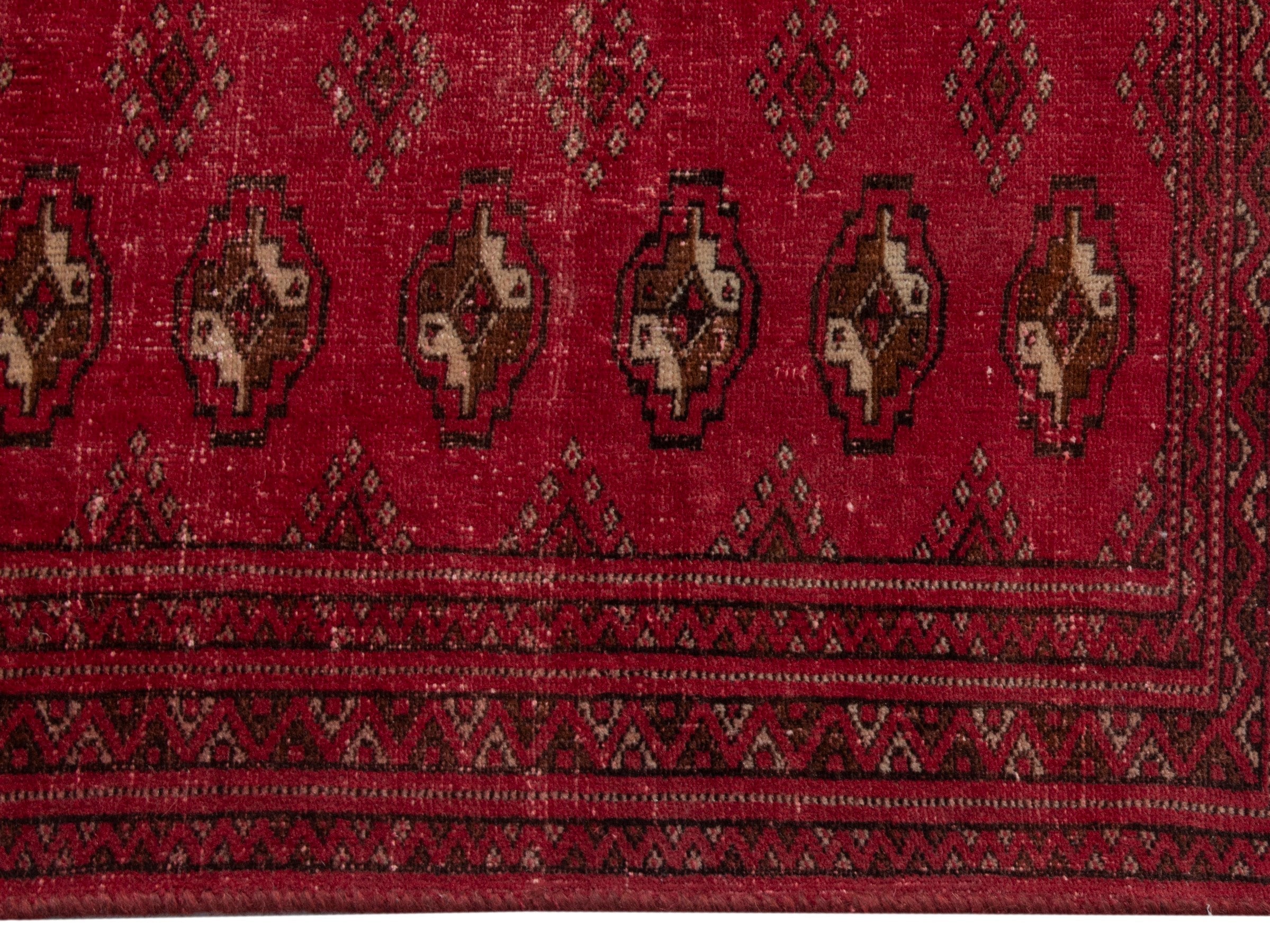 Persian Torkaman accent rug in deep red and gold, view 10 of 17