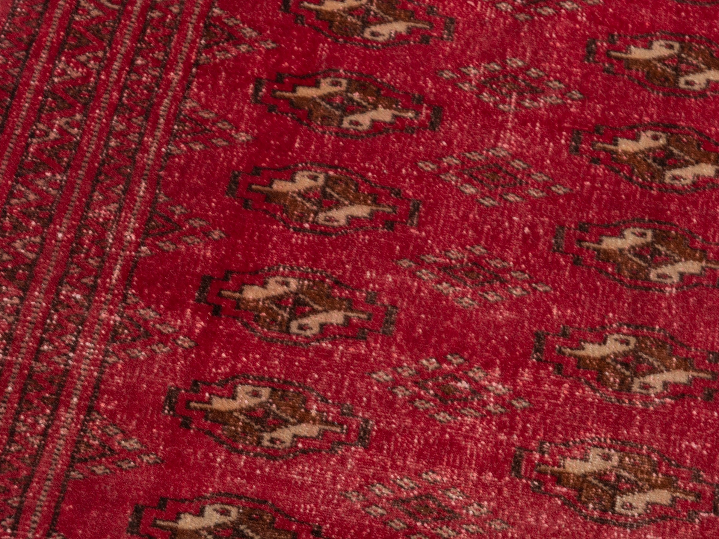 Persian Torkaman accent rug in deep red and gold, view 9 of 17