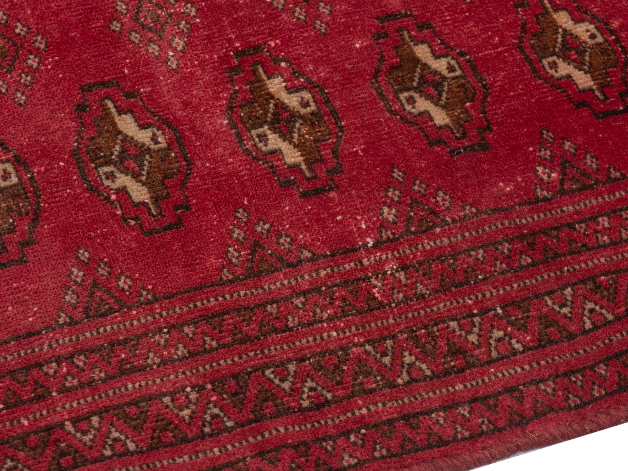 Persian Torkaman accent rug in deep red and gold, view 6 of 17