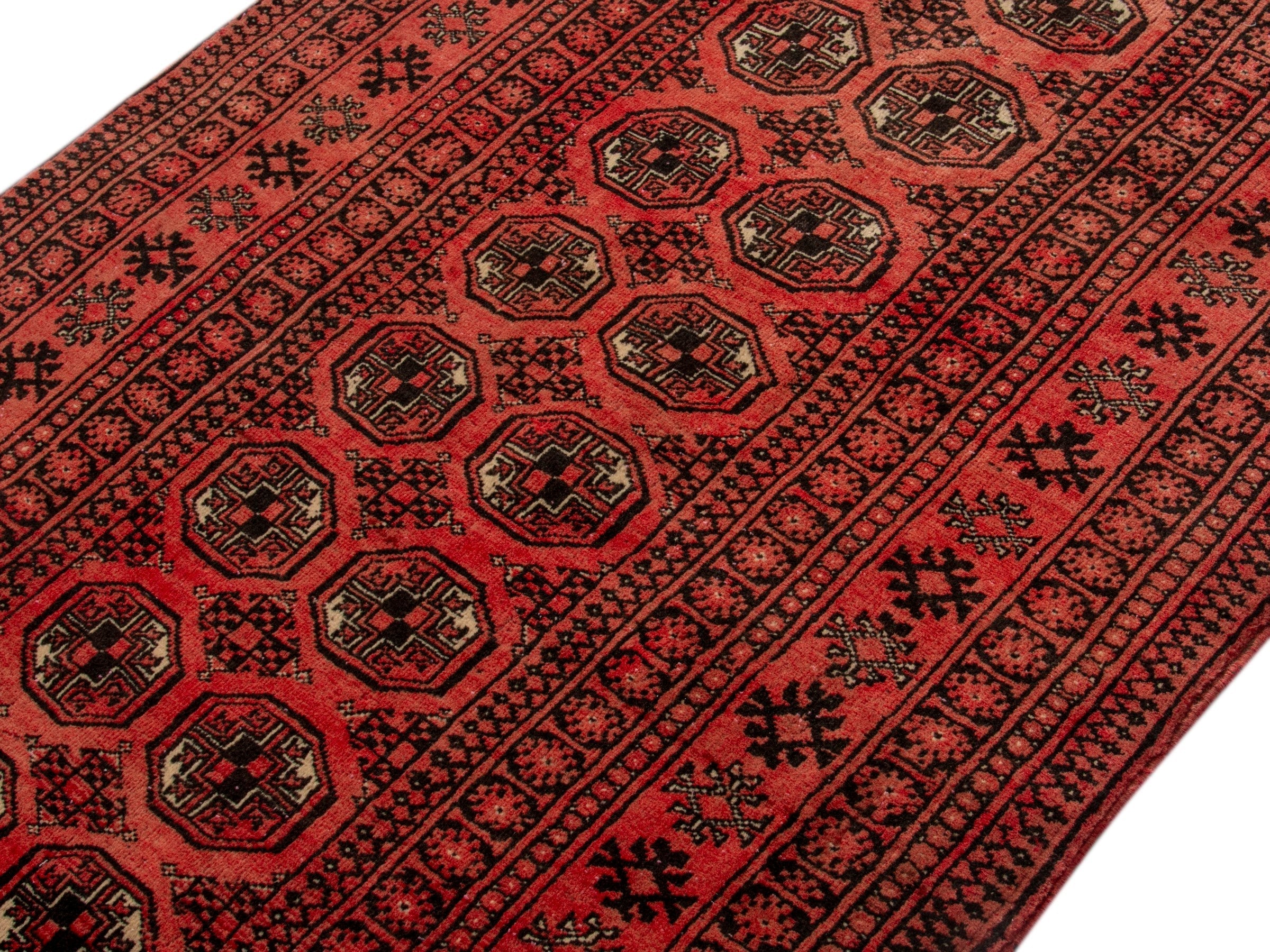 Persian Torkaman accent rug in deep red and rust, view 4 of 19