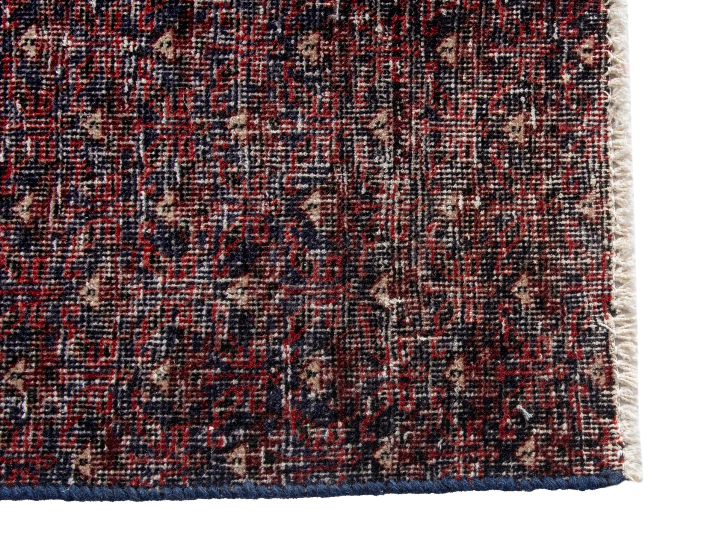 Persian Baluch accent rug in burgundy and faded red, view 10 of 17