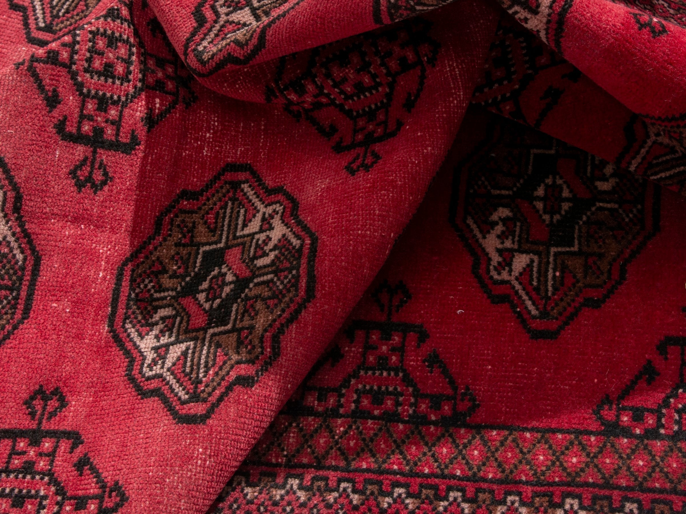 Persian Torkaman accent rug in deep red and dark brown, view 16 of 17
