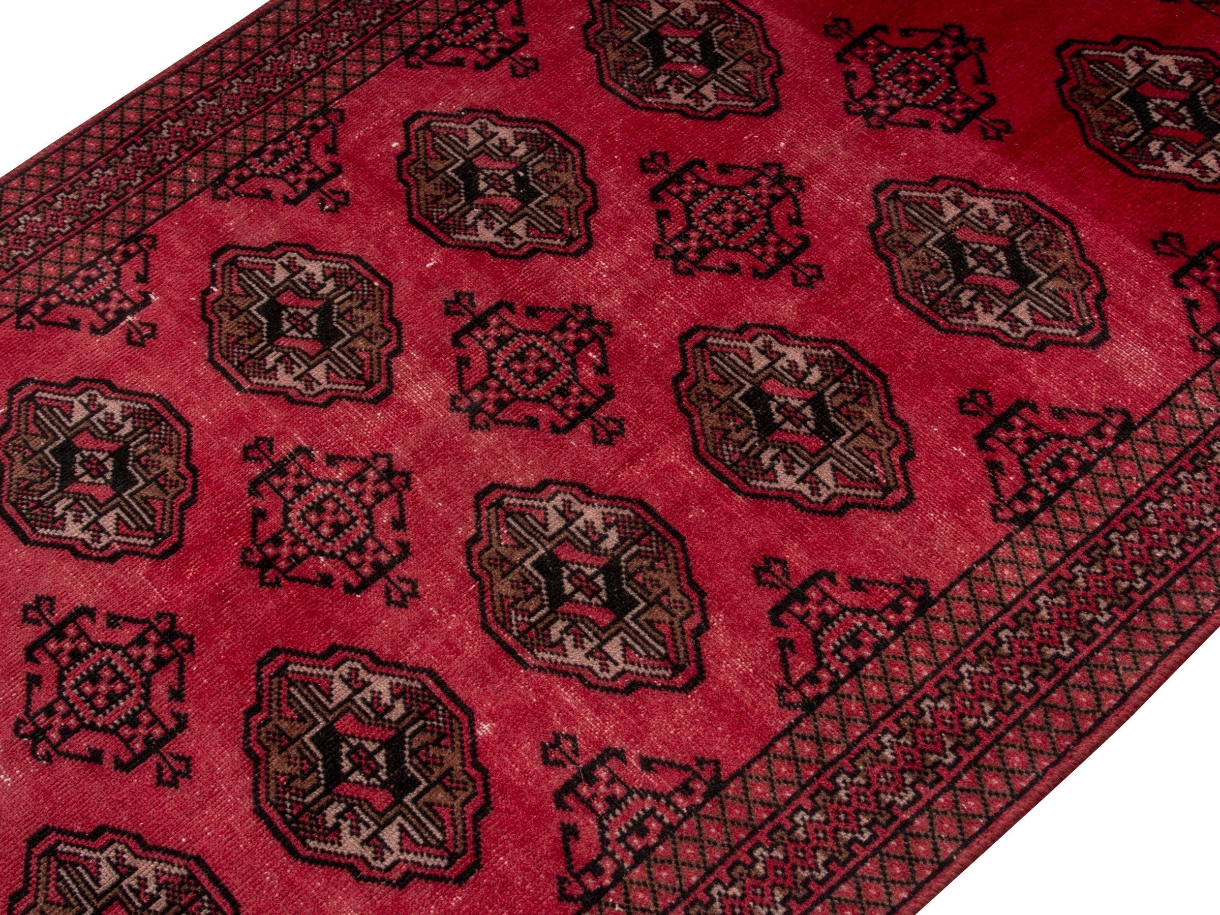 Persian Torkaman accent rug in deep red and dark brown, view 4 of 17