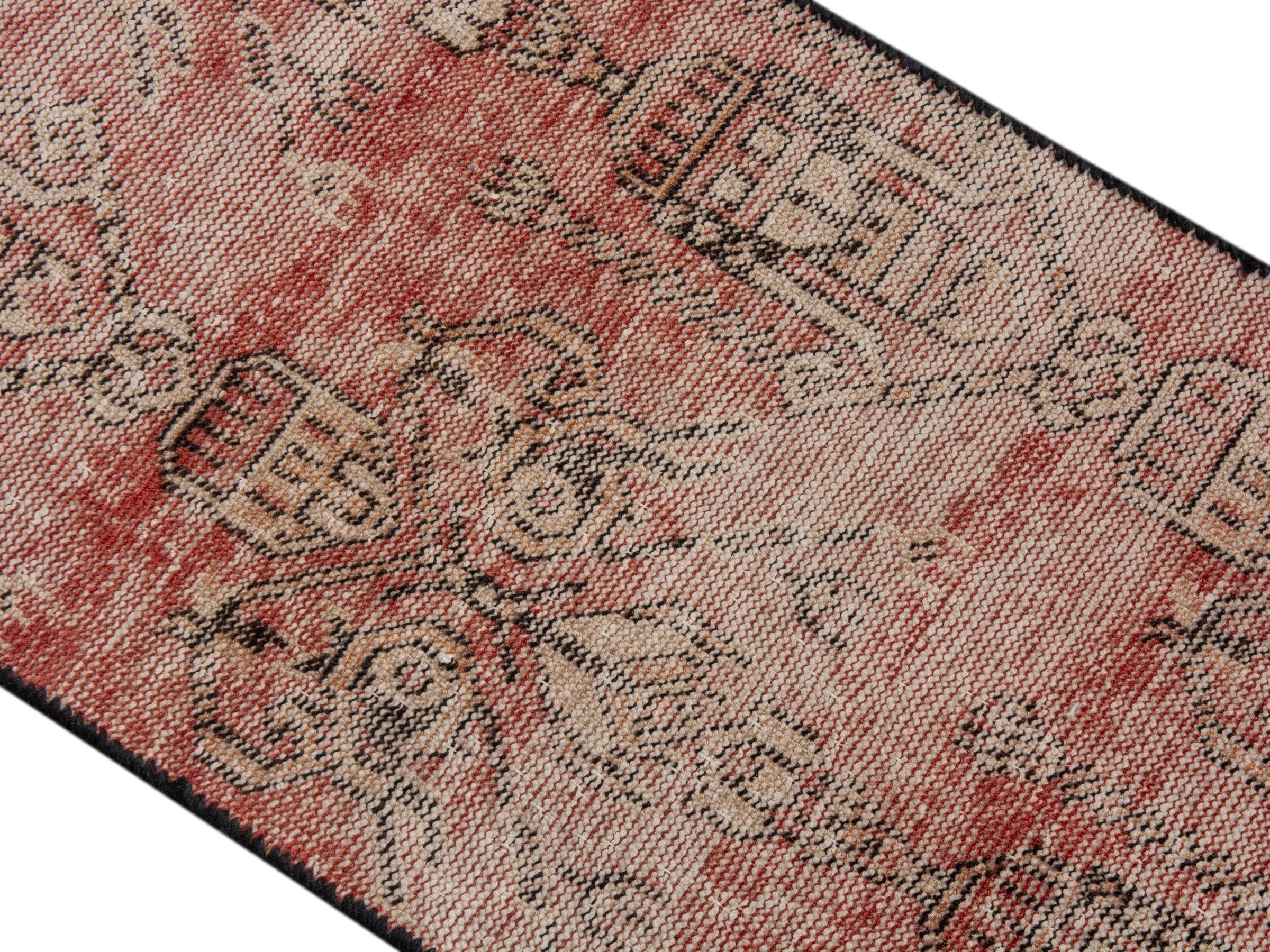 Persian Baluch accent rug in terracotta and muted pink, view 4 of 15
